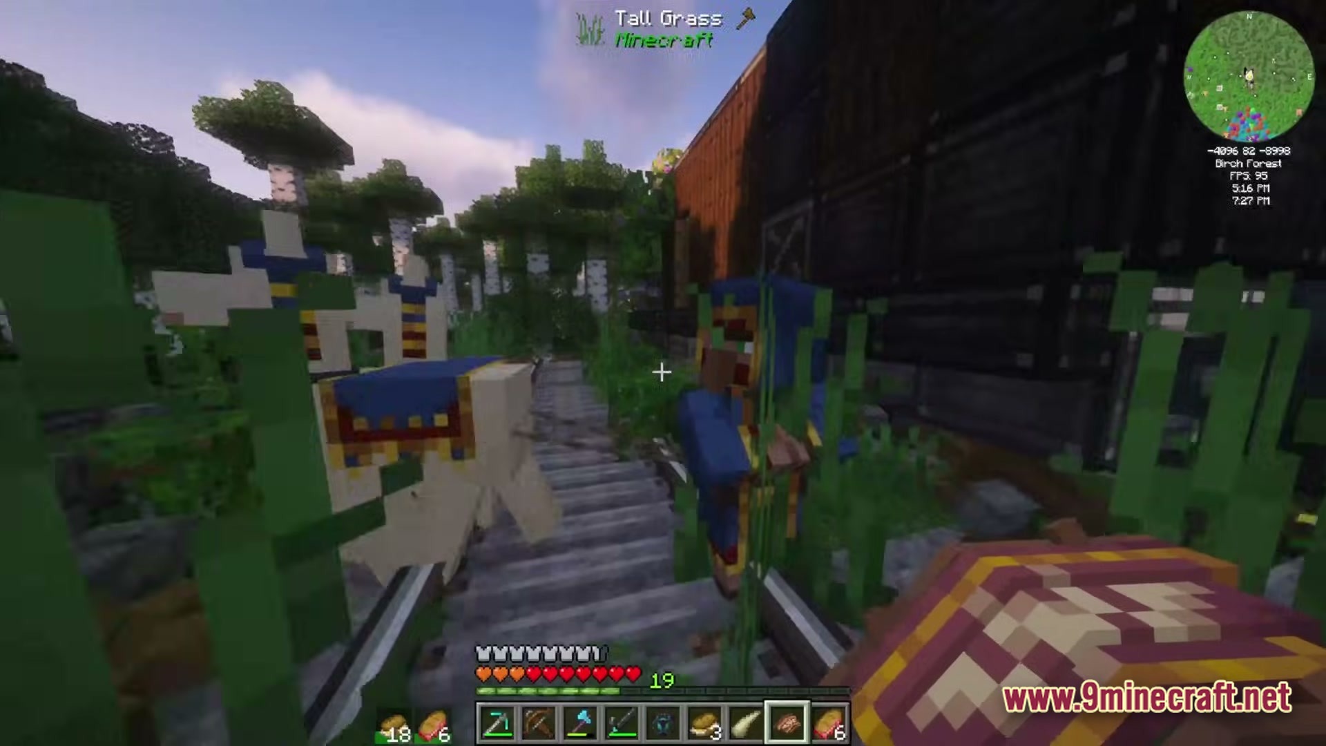 A wandering trader and his llamas stand on a railway track within a birch forest biome