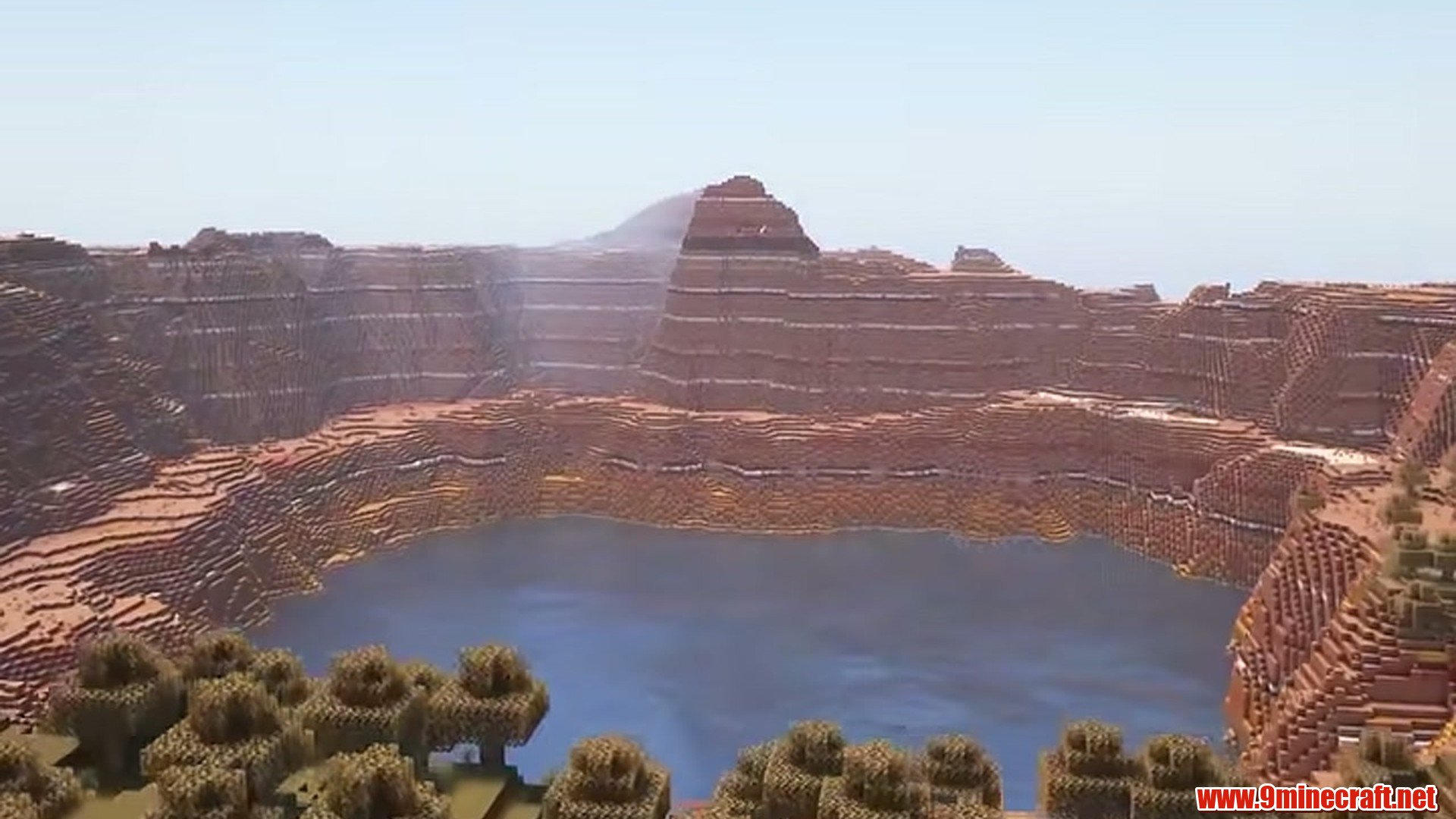 Best Seeds For Minecraft (26.2, 1.21.11) Part 11 – Java/Bedrock Edition 17 Second landscape view of badlands crater lake