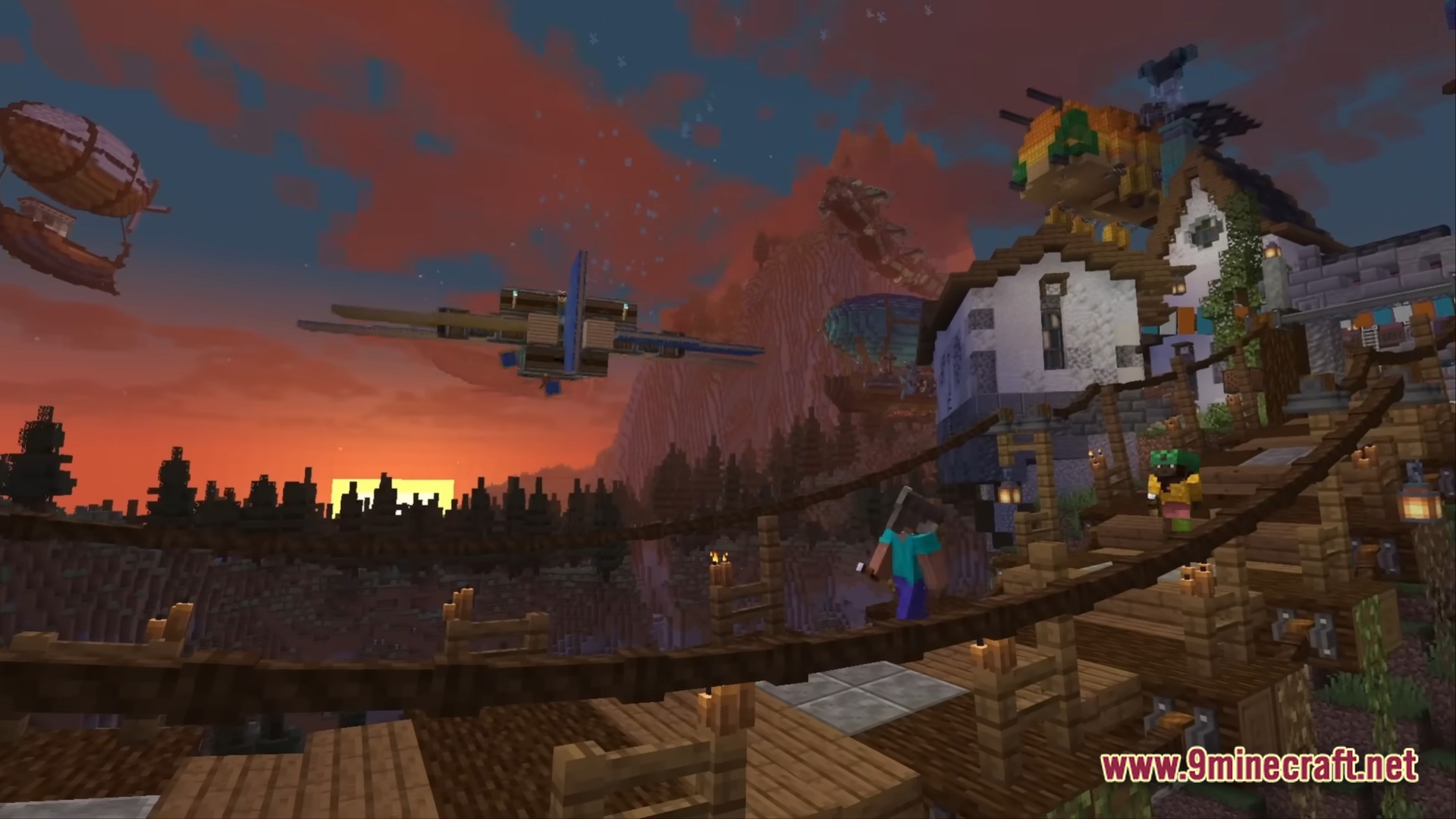 Better Create Aeronautics With Create Addons &Amp; Improvements Modpack (1.21.1) – Build And Fly Custom Aircraft 9 A player stands on a wooden bridge overlooking aircraft and buildings during a sunset