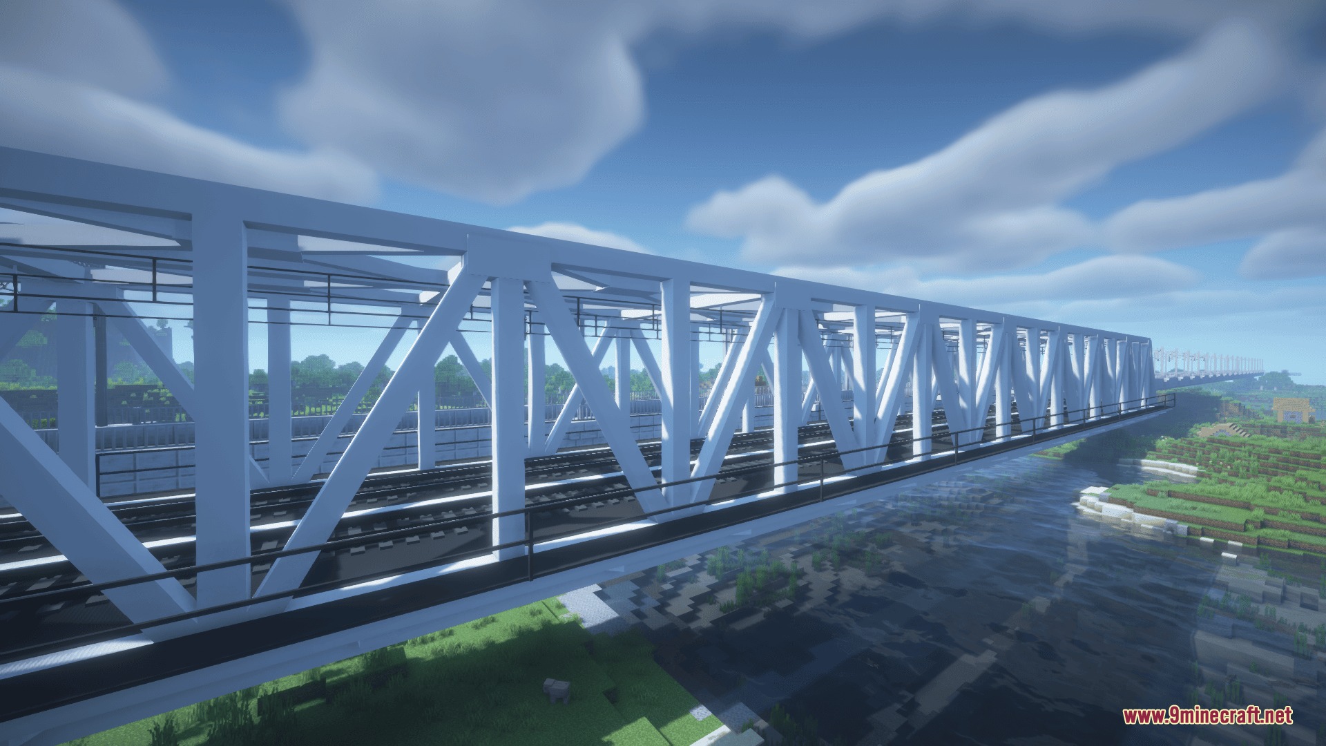 A long white metal railway bridge spanning across a river in minecraft