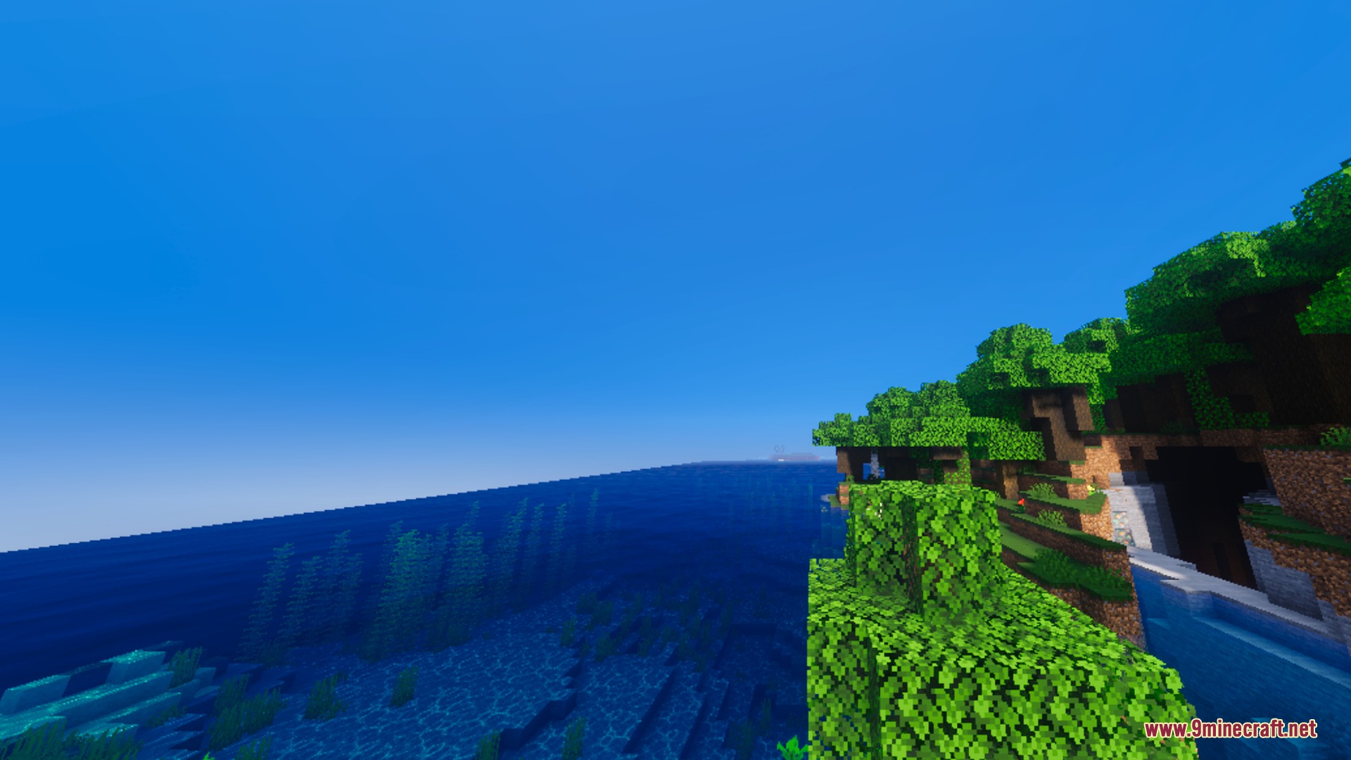 Bsl Vibrant Visuals Shader (26.X) – Clear Water And Glowing Ores Without Rtx 2 Lush green trees on a cliff overlooking clear blue water and underwater plants