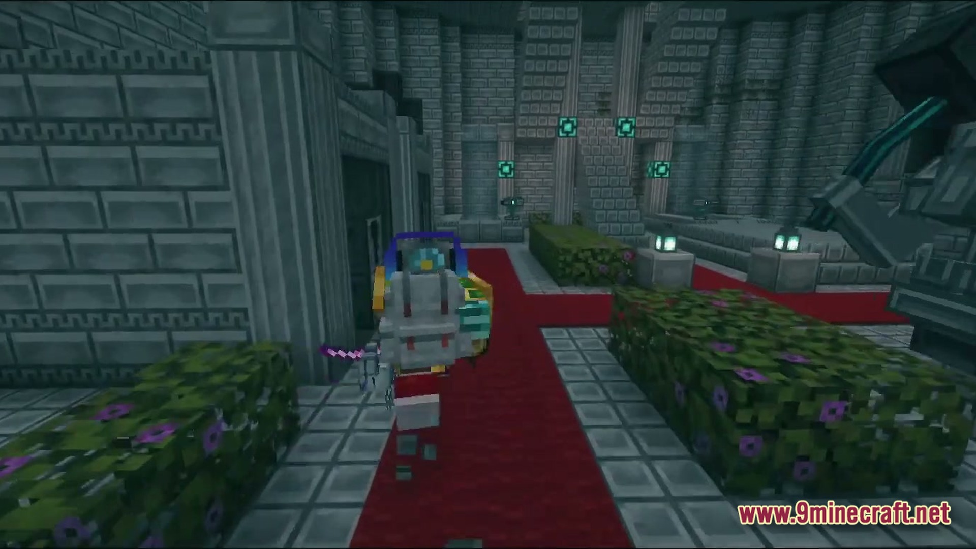 A player wearing a backpack walks through a stone temple with red carpets and flowering hedges