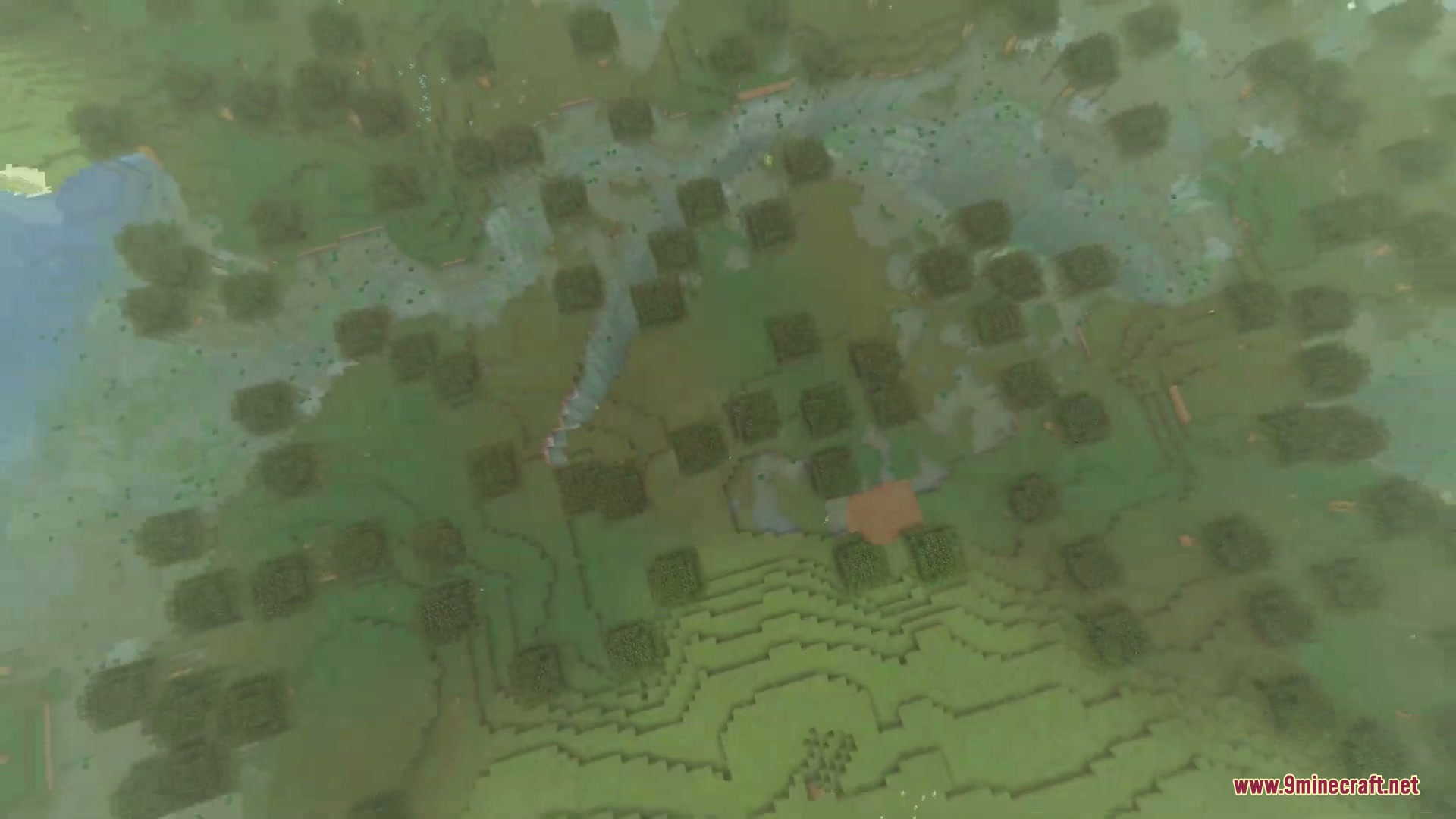 Aerial cinematic view of a swamp biome with a river