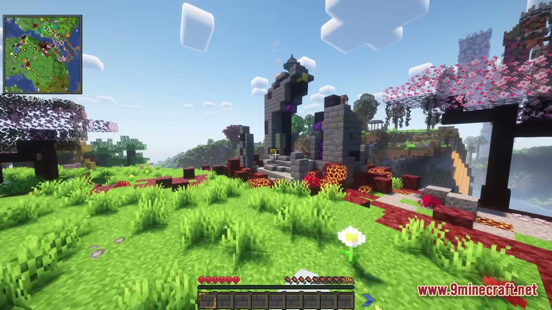 Cisco’s Fantasy Medieval Rpg Modpack (1.20.1) – Ultimate Medieval Fantasy Rpg Adventure 7 A ruined nether portal structure stands in a grassy biome near cherry blossom trees and mountains