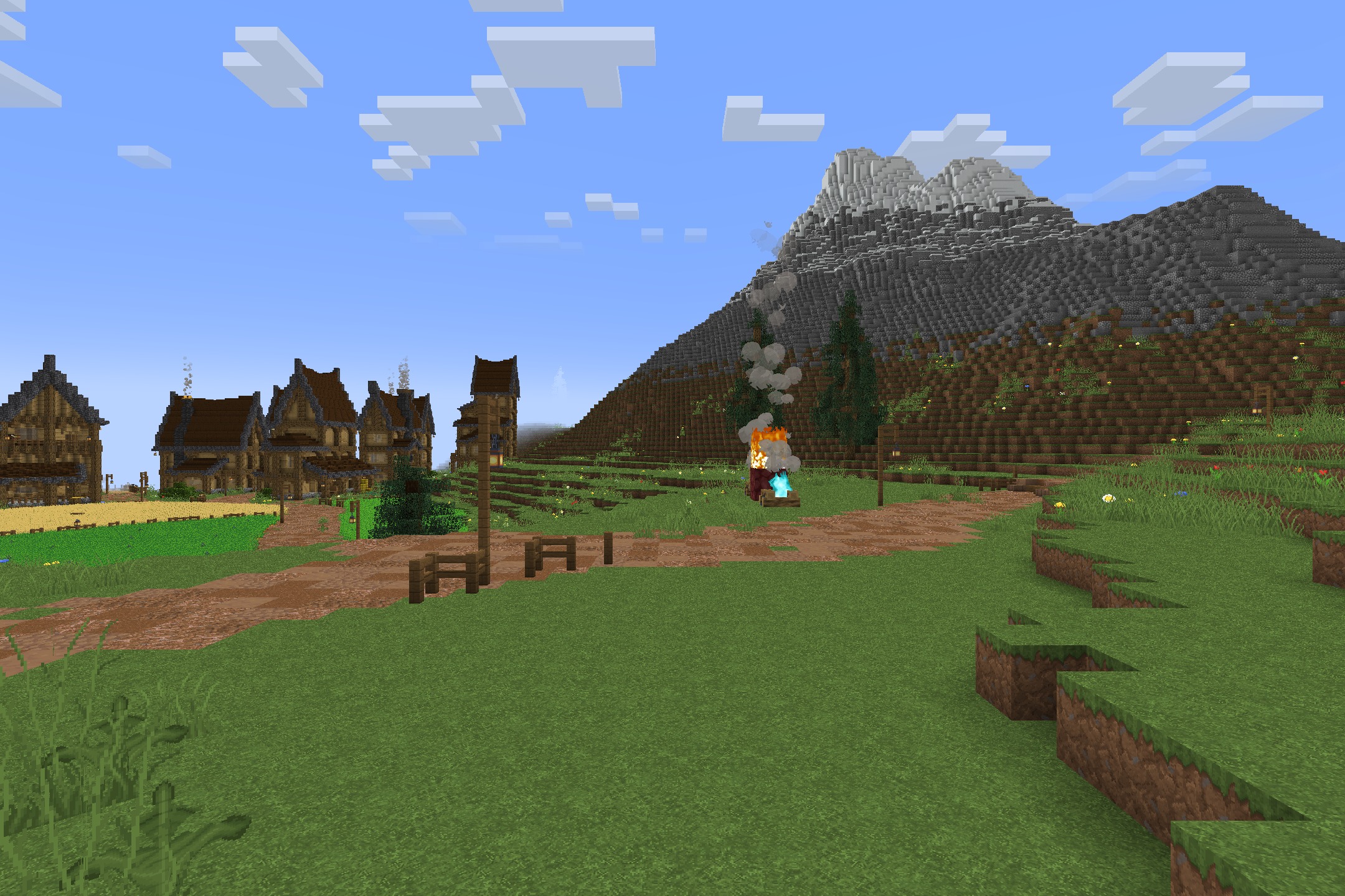 Classic Faithful 64X Jappa Resource Pack (26.2, 26.1.2) 3 A peaceful village with wooden houses and a campfire near a large mountain