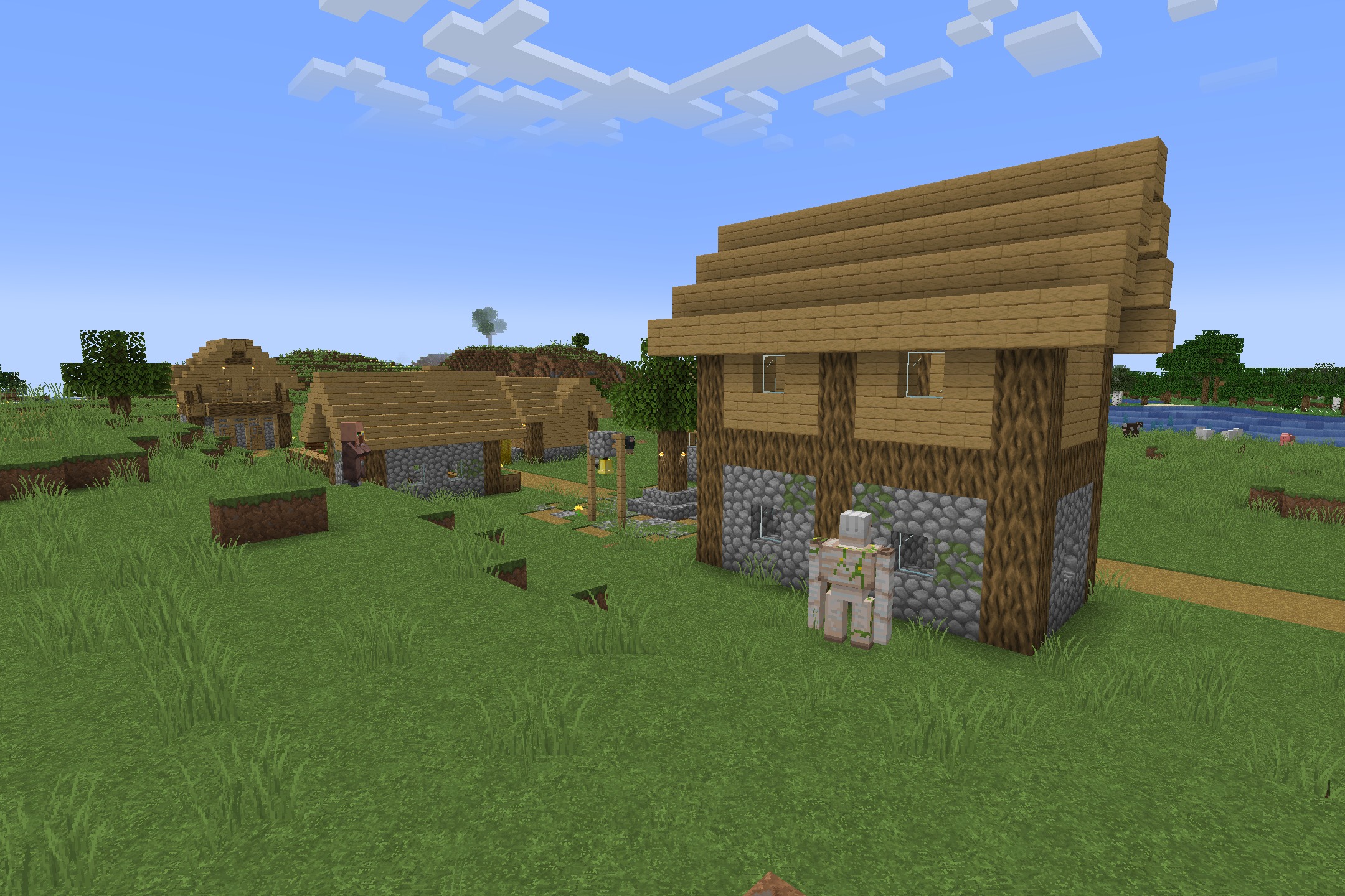 Classic Faithful 64X Jappa Resource Pack (26.2, 26.1.2) 4 An iron golem stands near a village house with high resolution block textures