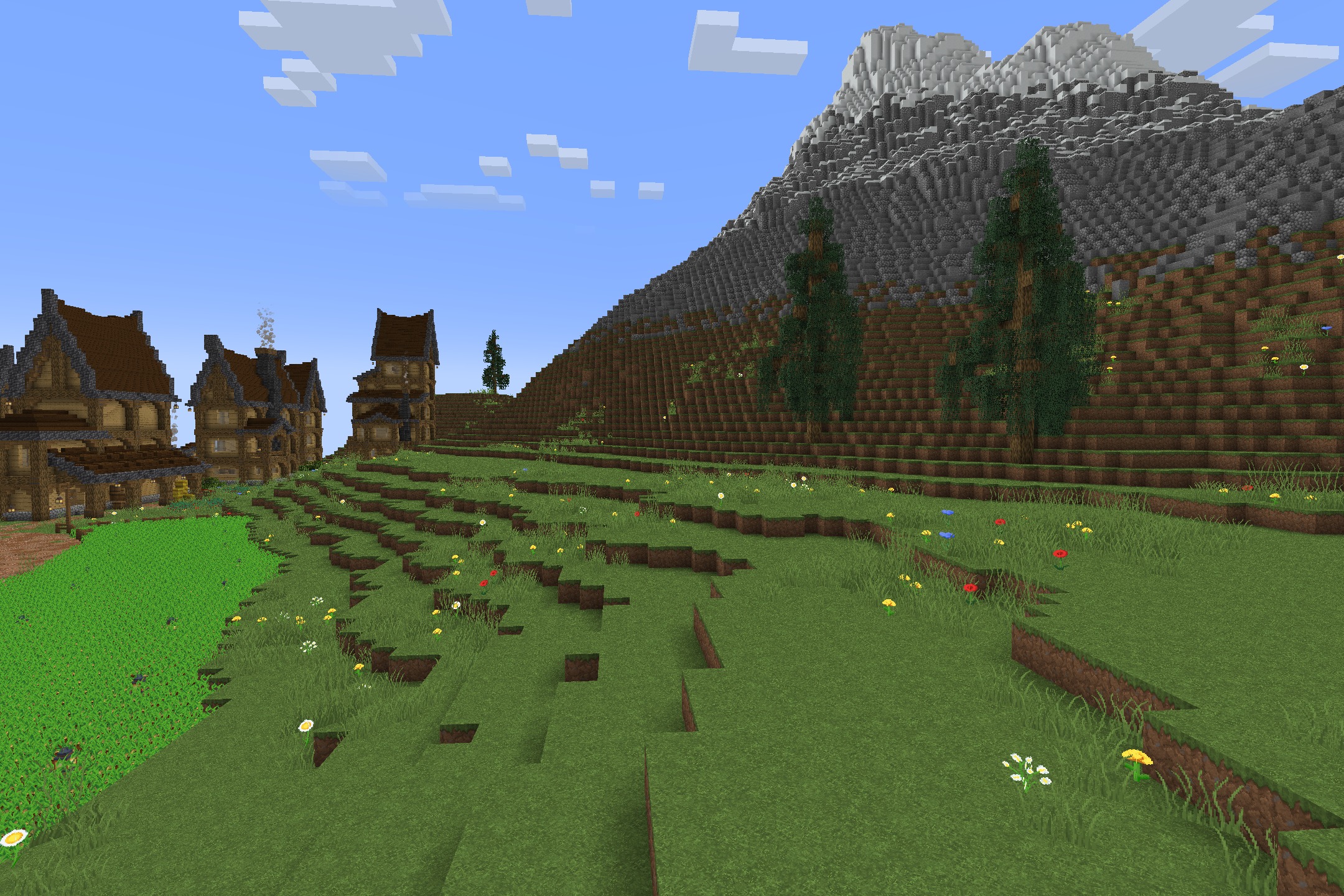 Classic Faithful 64X Jappa Resource Pack (26.2, 26.1.2) 5 Scenic mountain landscape with detailed grass and houses using classic faithful style
