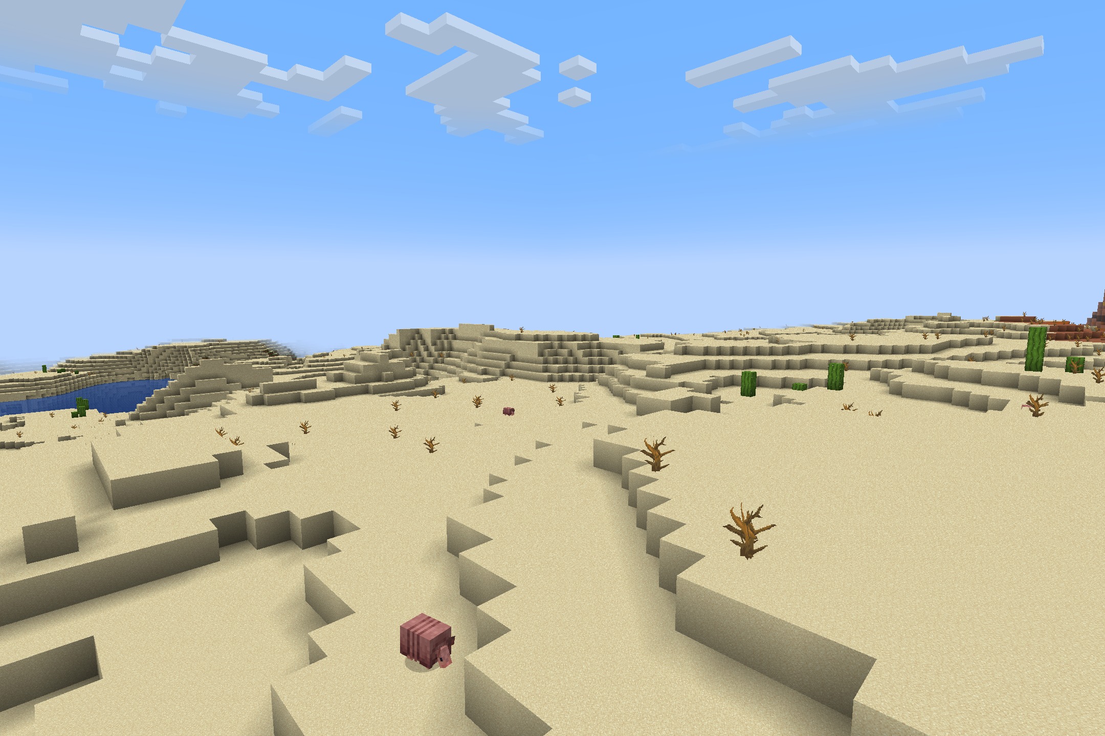 Classic Faithful 64X Jappa Resource Pack (26.2, 26.1.2) 10 A pink armadillo wanders through a desert biome with high resolution sand blocks