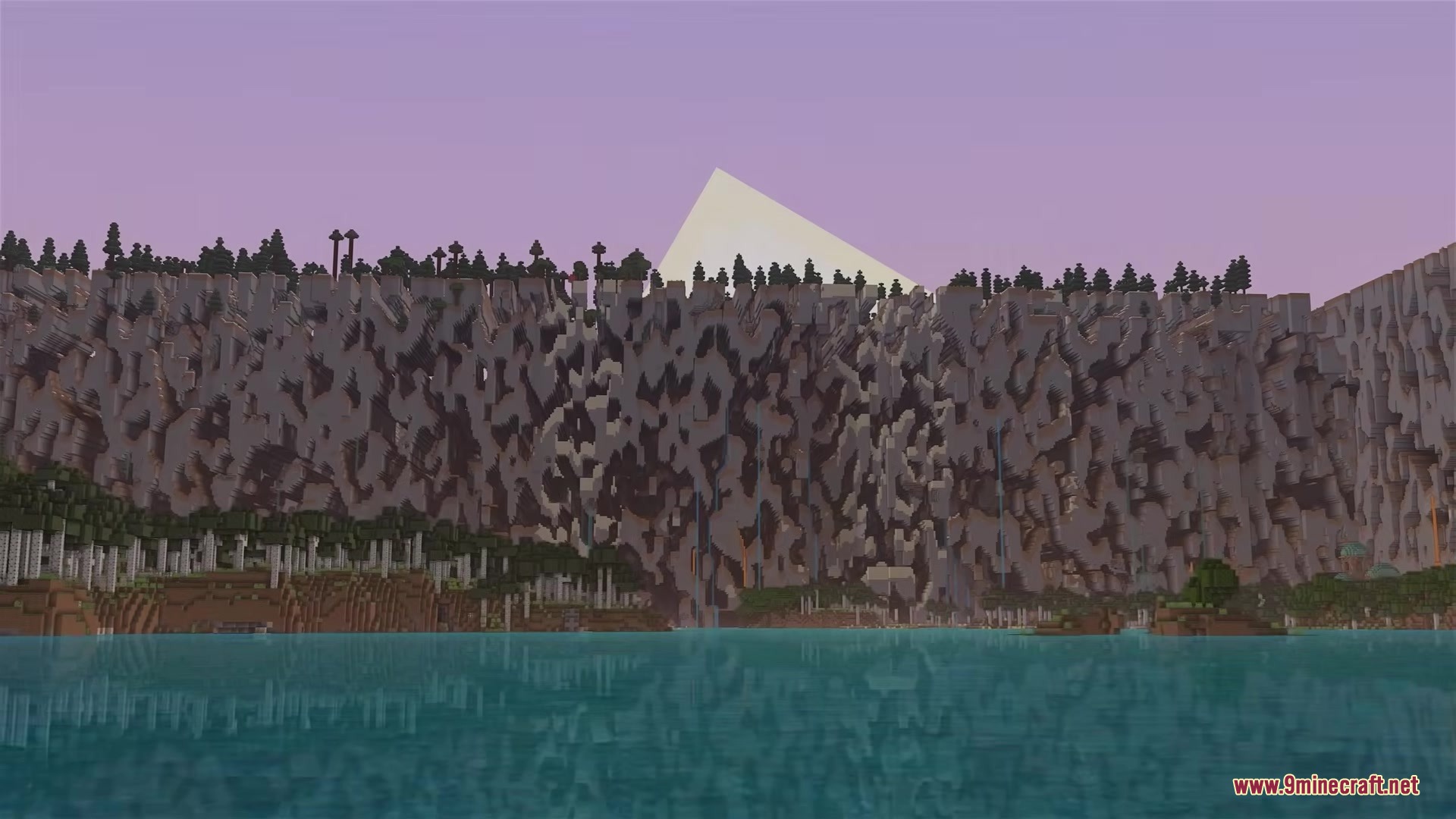 Massive walls of broken terrain generation stretch across the horizon over the ocean