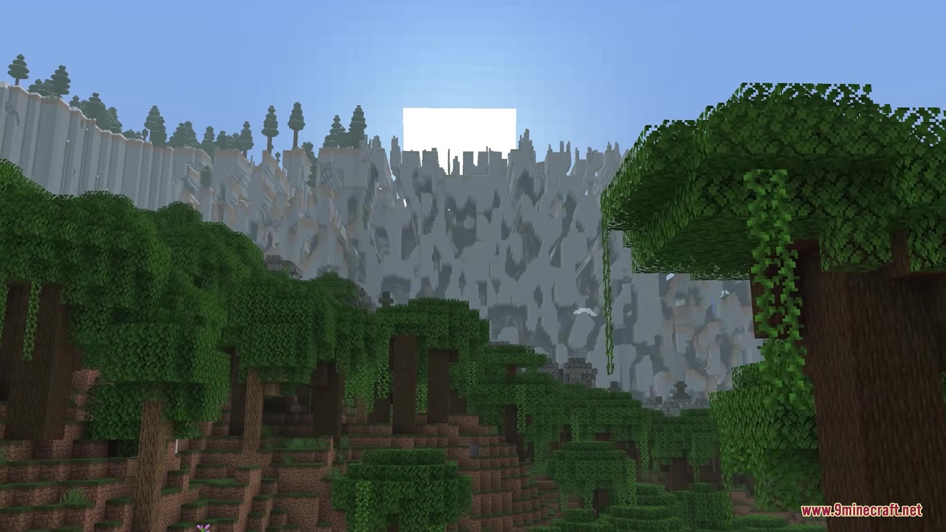 Dense jungle trees overlook a massive wall of broken terrain blocks