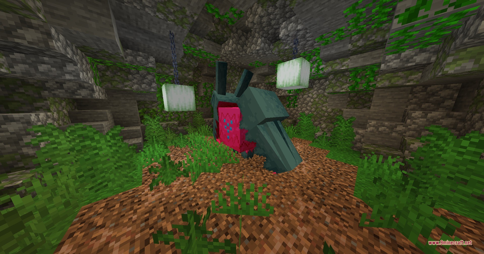 A large dragon creature inside a mossy stone cave with hanging sea lanterns