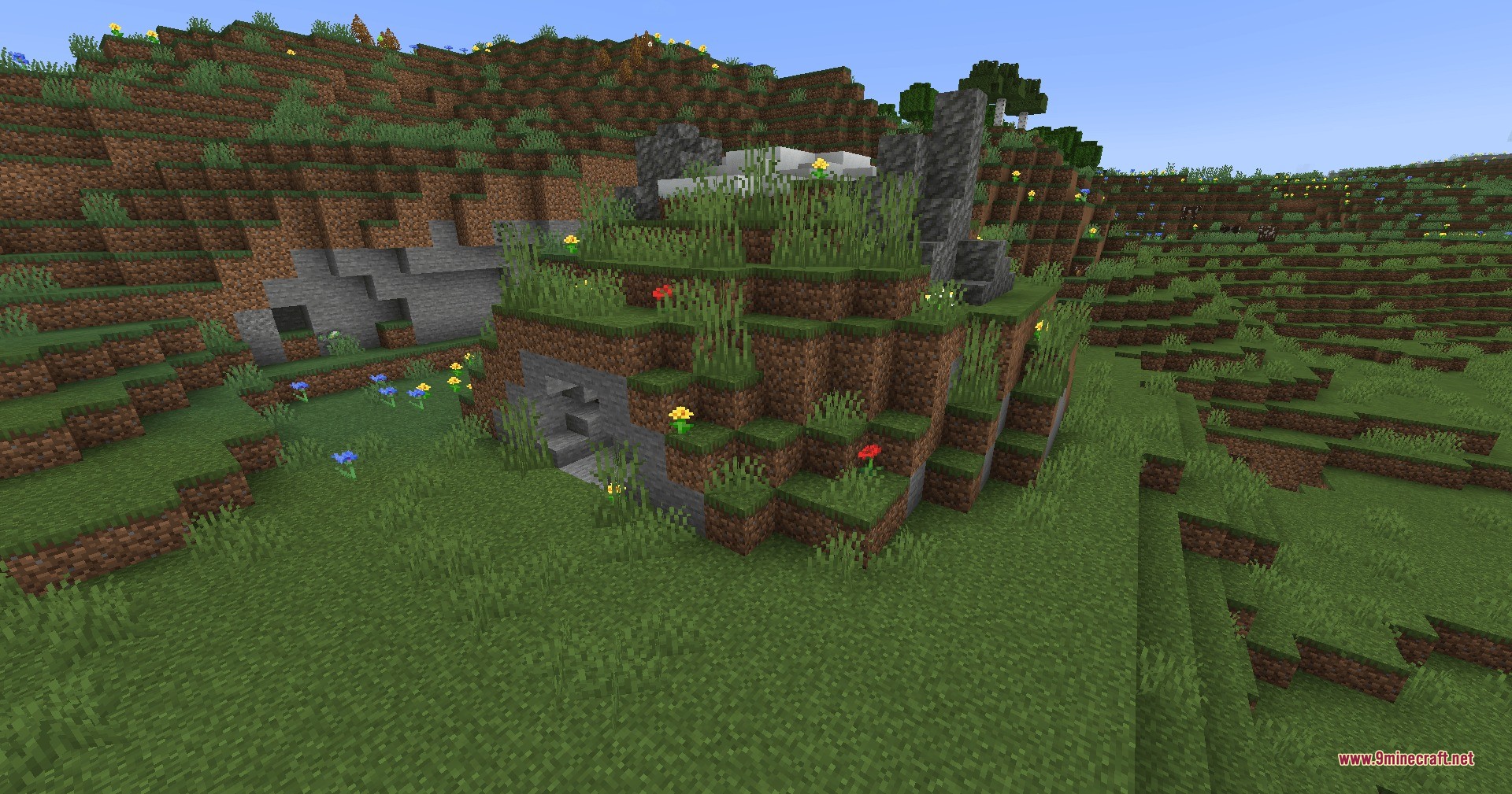 A mysterious grassy mound structure hidden in a hilly minecraft biome