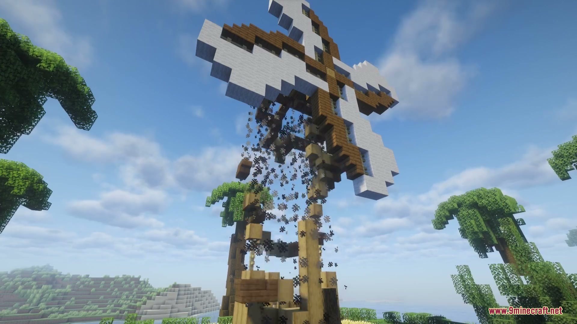 Combustive Ordnance Expansion Mod (26.1.2, 1.20.1) – Turn Tnt Into Realistic 3 A massive artillery style explosion destroying a wooden windmill with thick smoke clouds
