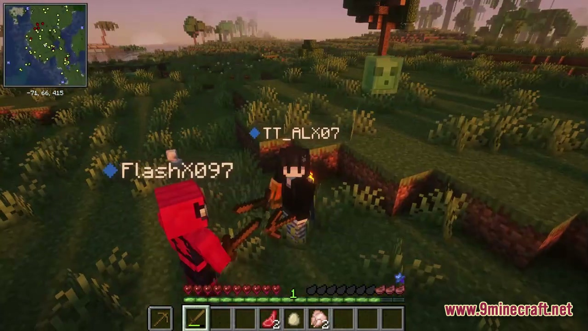 Two players stand in a grassy field near a slime during sunset in a modded world
