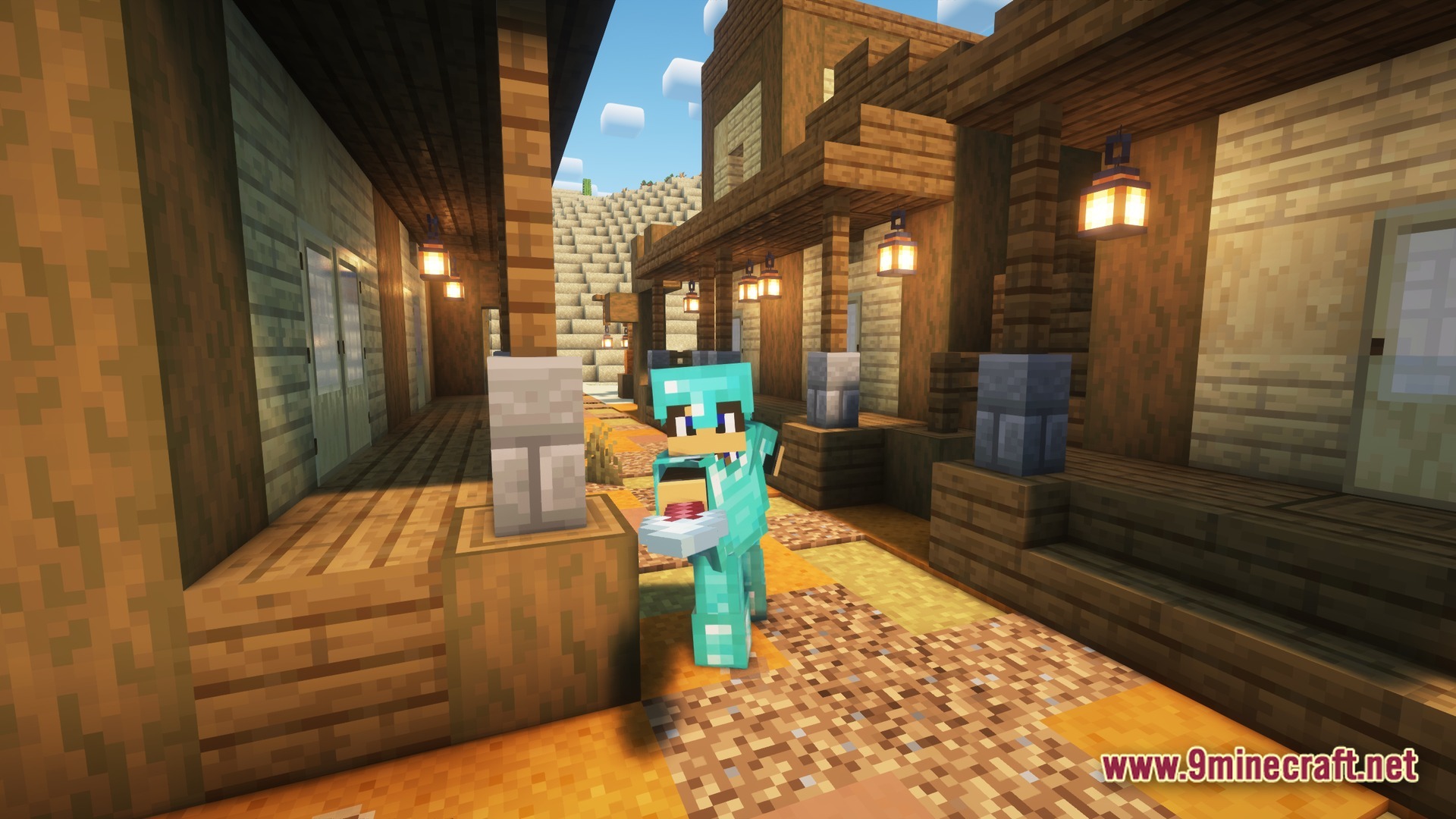 A player in diamond armor stands between wooden buildings in a desert village settlement