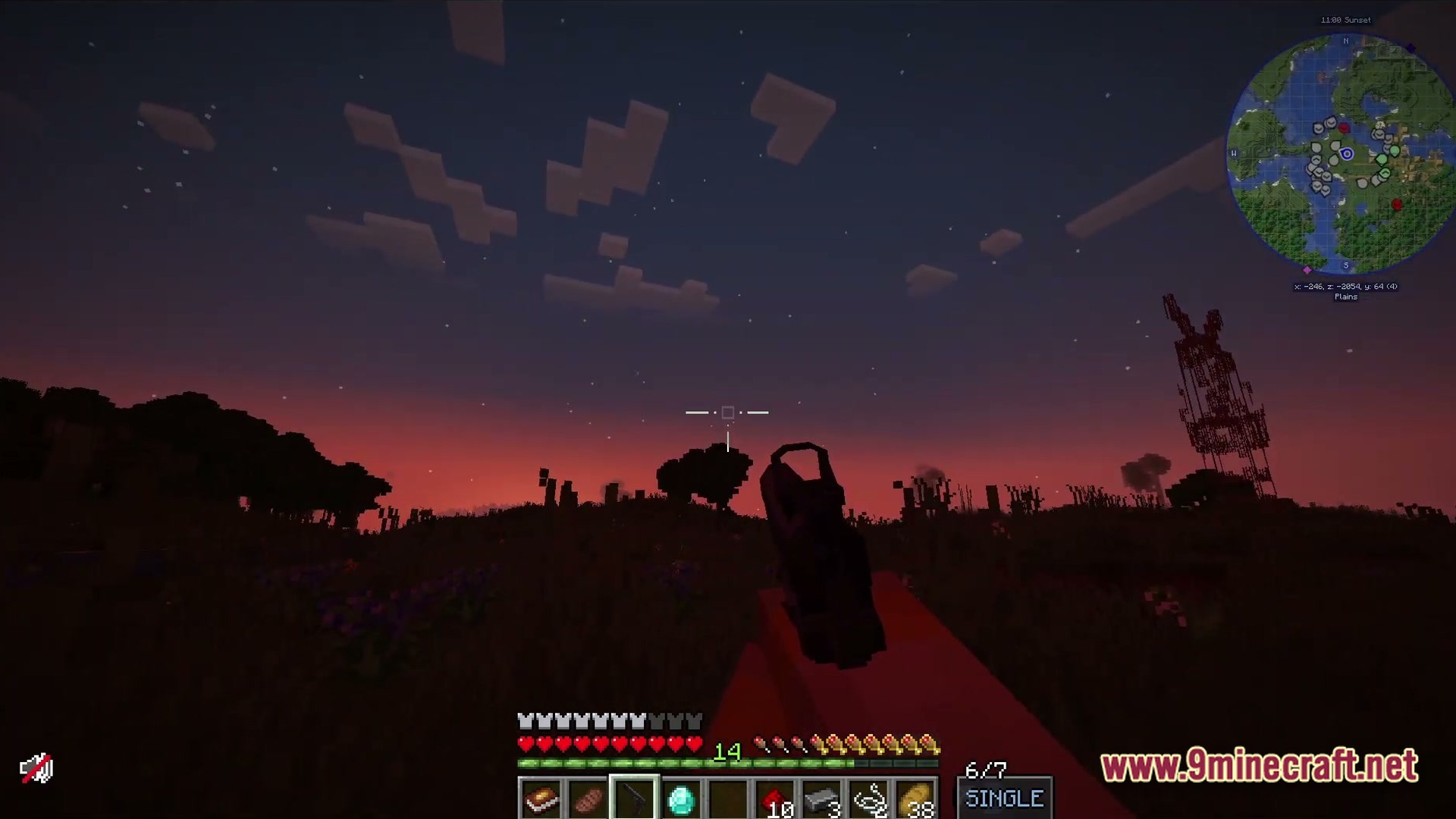 A player holds a firearm at sunset in a plains biome with a radio tower nearby