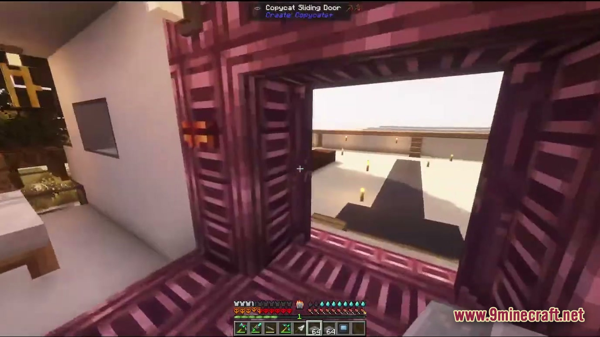 A player looks through an open copycat sliding door toward a brightly lit outdoor courtyard