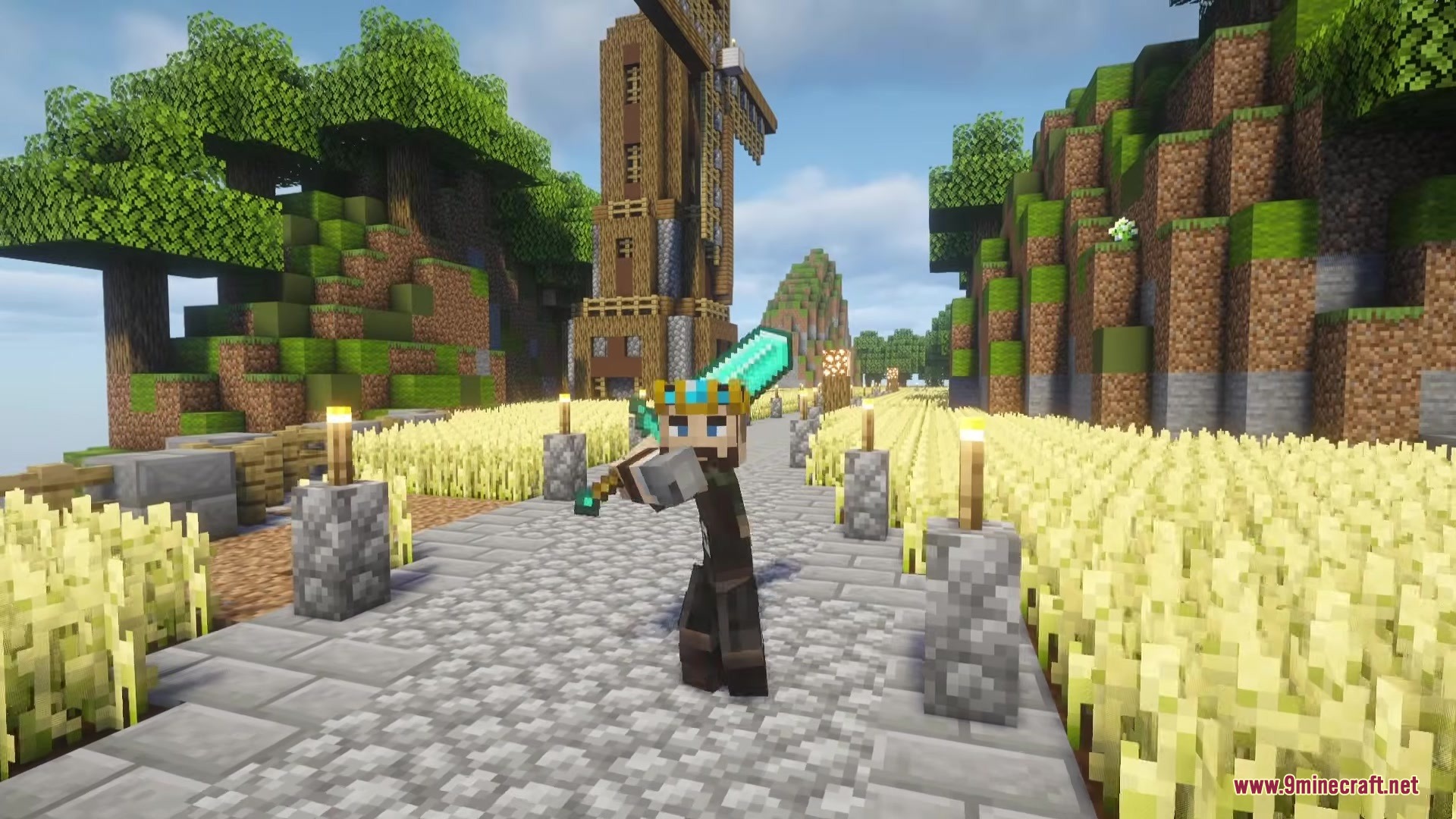 A player wearing a crown holding a diamond sword near a large windmill