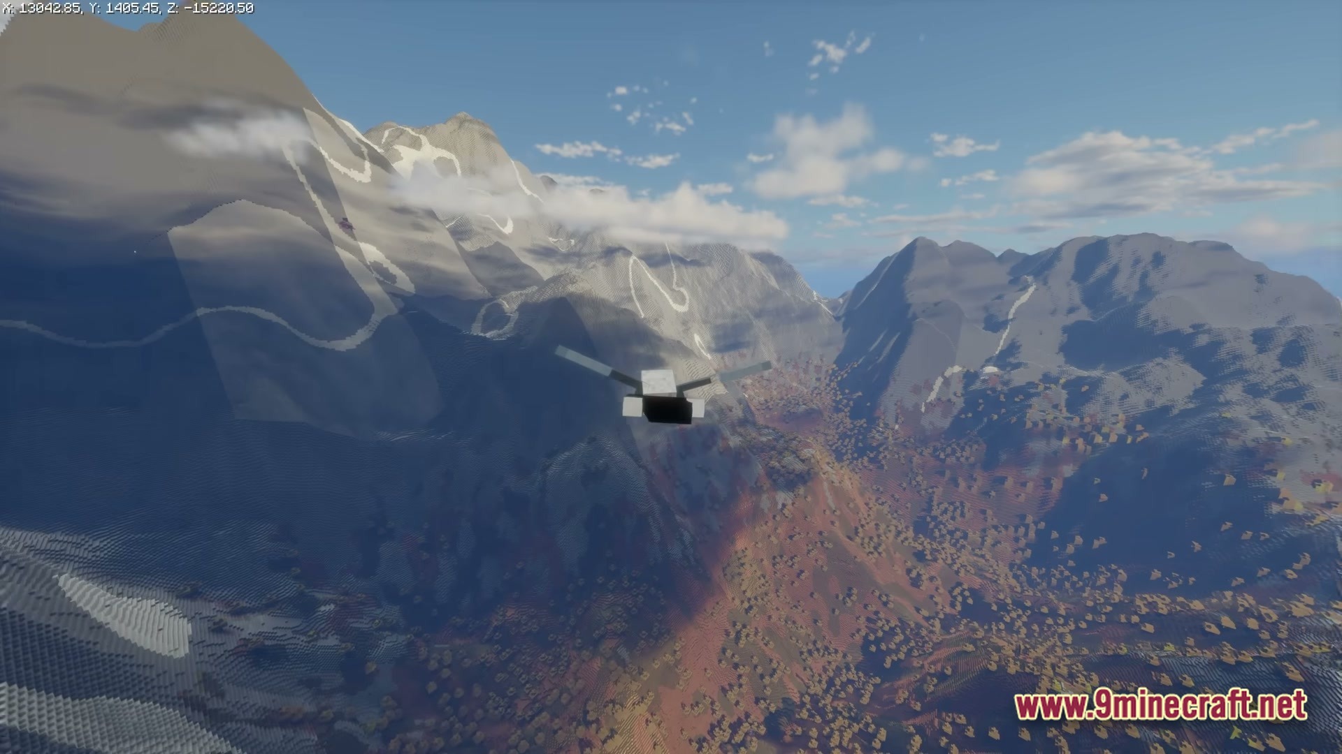 Ff’s Terra Forge Modpack (1.21) – Explore Massive Biomes And Dungeons 3 A player glides over a vast mountain range and forested valley using an elytra