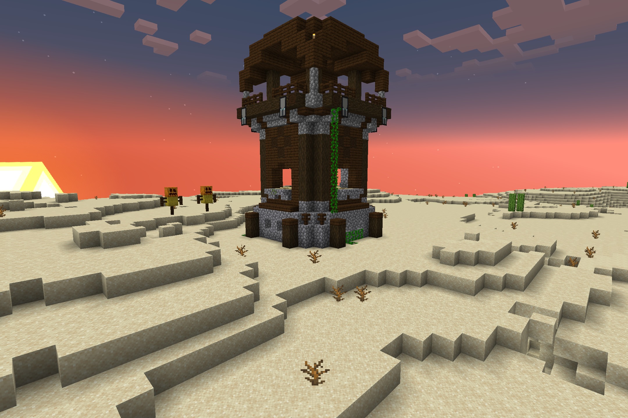 A pillager outpost stands in a desert biome during a colorful sunset