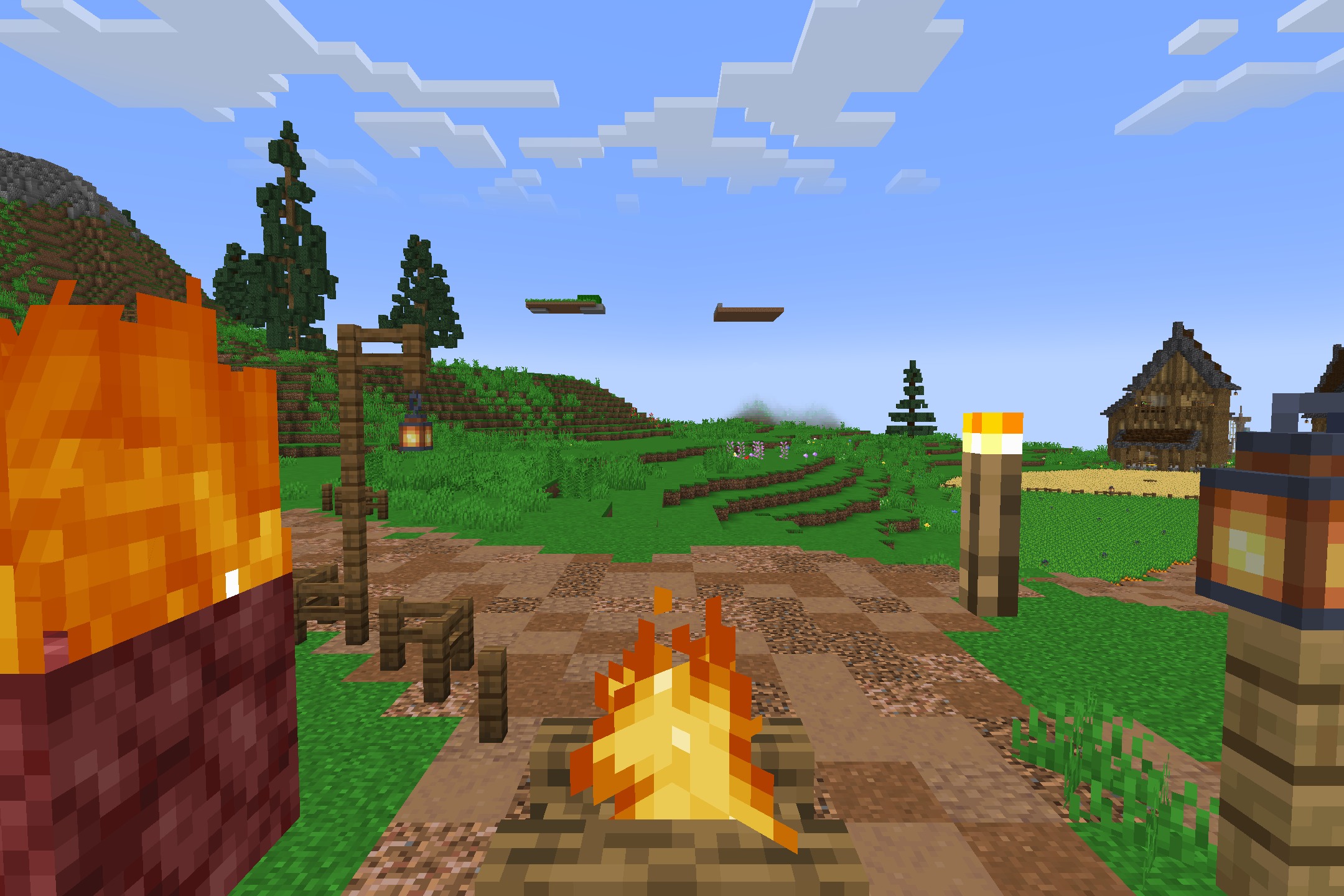 Campfires burn on a dirt path leading toward a small wooden house