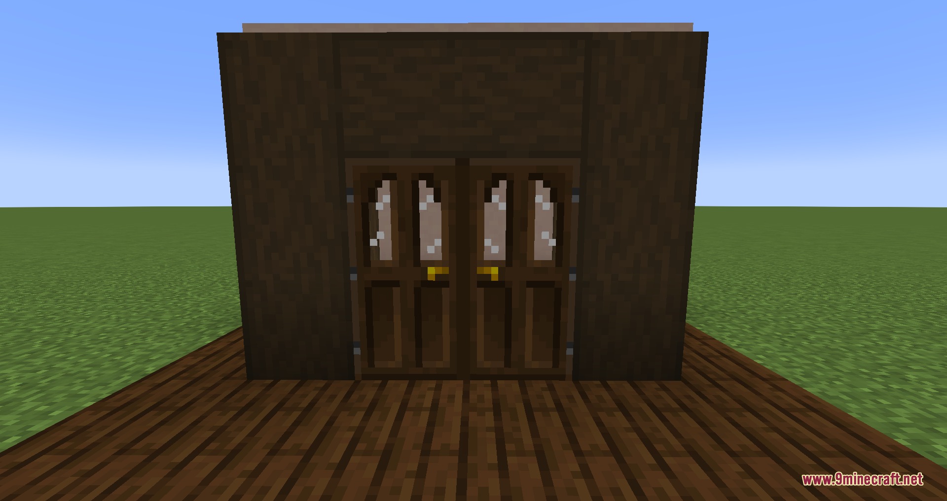 Dark oak doors with glass panes set in a dark wooden wall