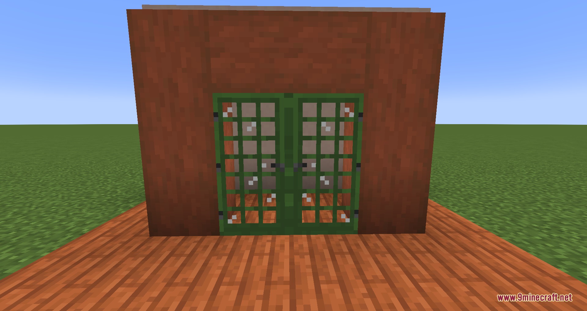 Green wooden doors with glass window panes in a reddish wooden wall