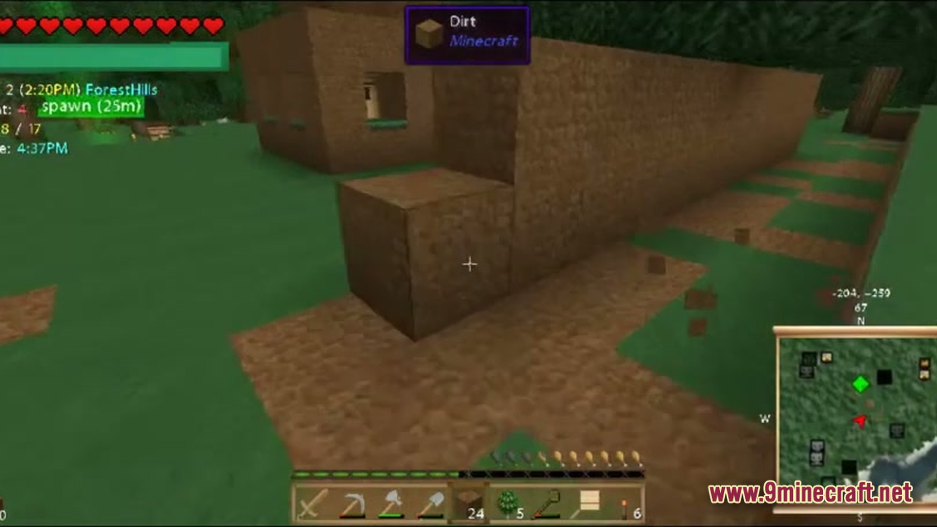 A player builds a dirt wall in a forest biome with a minimap and hud visible