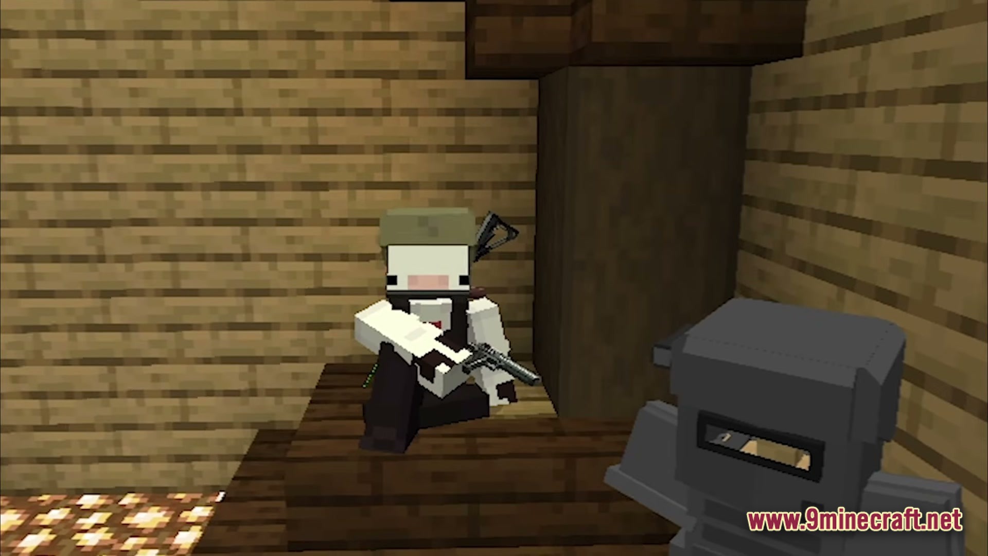 Guns And Poses Gap Modpack (1.20.1) – Guns Quests And Cool Poses 6 A player character in tactical gear holding a pistol while sitting inside a wooden structure