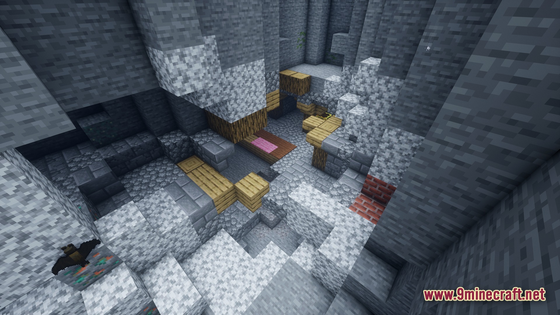 Immersive Experience Modpack (26.1) – Lifelike Visuals And Fresh Audio 10 A rocky underground cavern featuring wooden structures, various ore blocks, and a flying bat