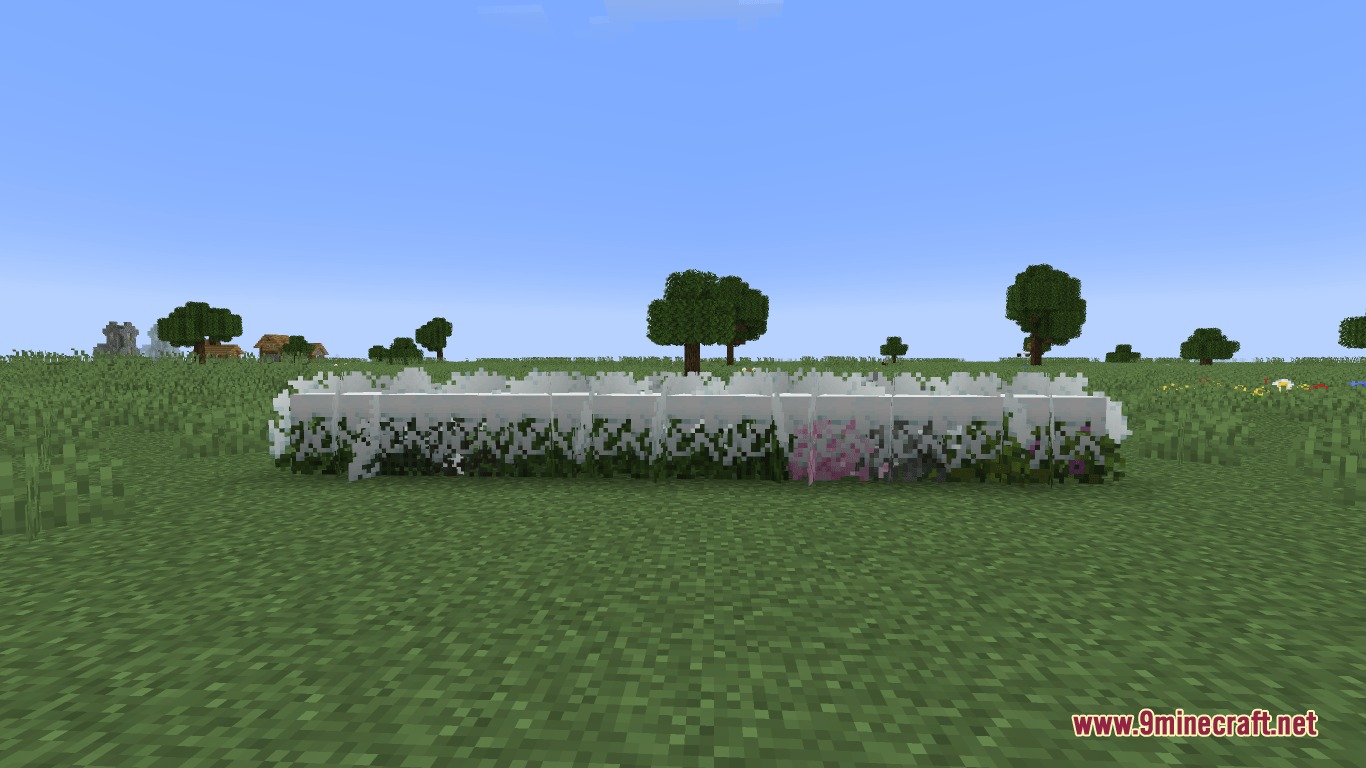 Immersive Snowy Leaves Bushy Leaves Resource Pack (1.21.11, 1.20.1) 2 Showcasing various bushy leaf blocks with snow layers on a grassy field