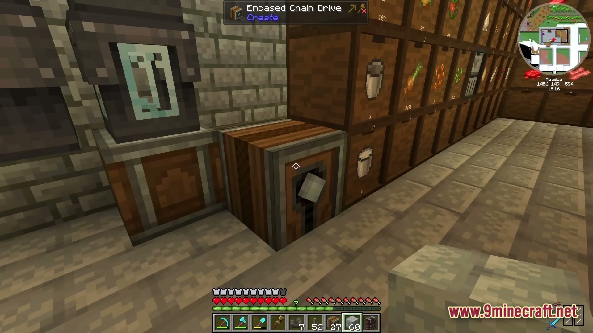 Industrial Banquet Crucible Modpack (1.20.1) – Automate Cooking And Gear Technology 2 An encased chain drive from the create mod placed next to a storage drawer wall