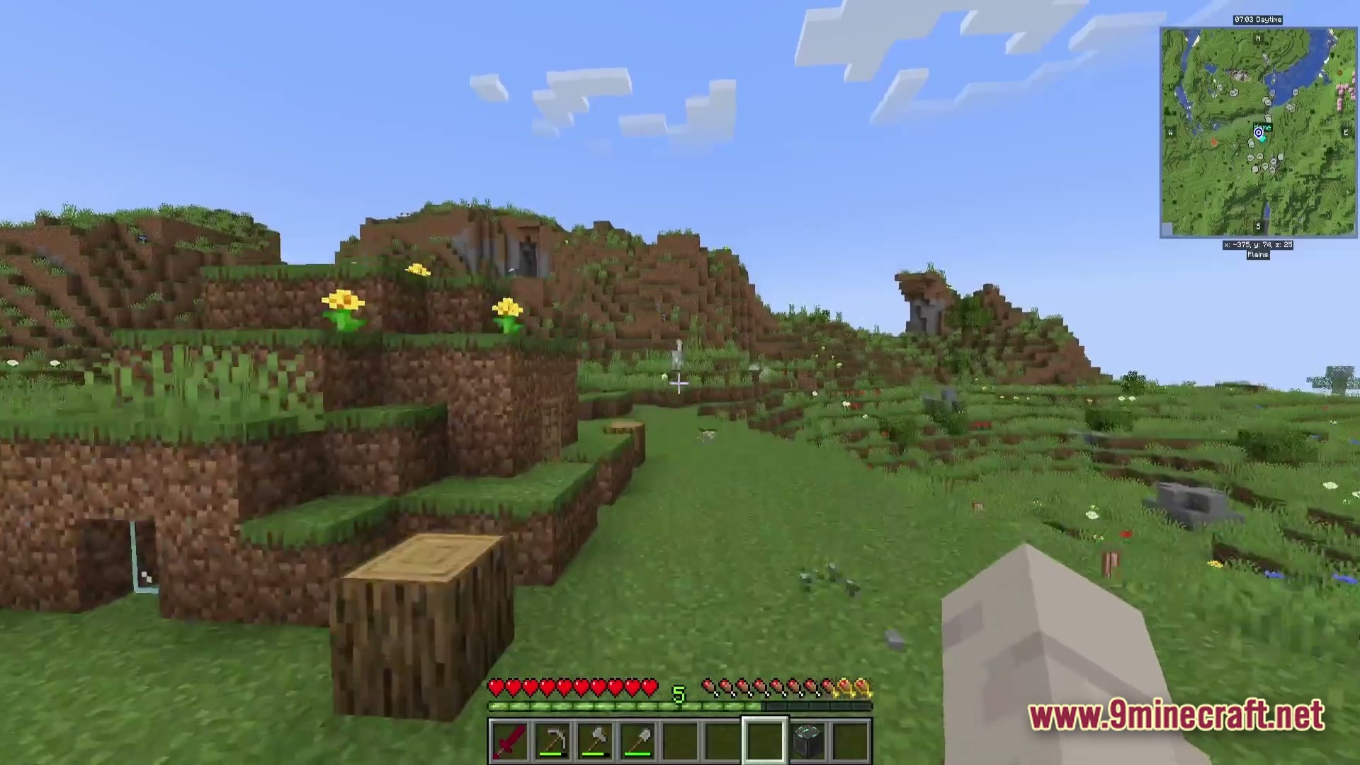 A first-person view of a grassy plains biome featuring rolling hills, yellow flowers, and a minimap