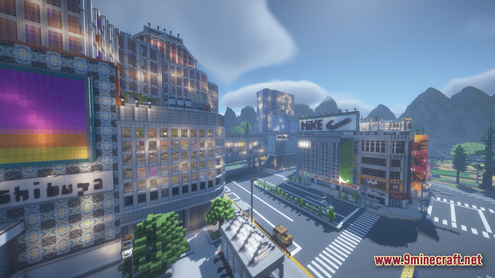 A minecraft recreation of the shibuya district featuring modern skyscrapers, city streets, and commercial billboards