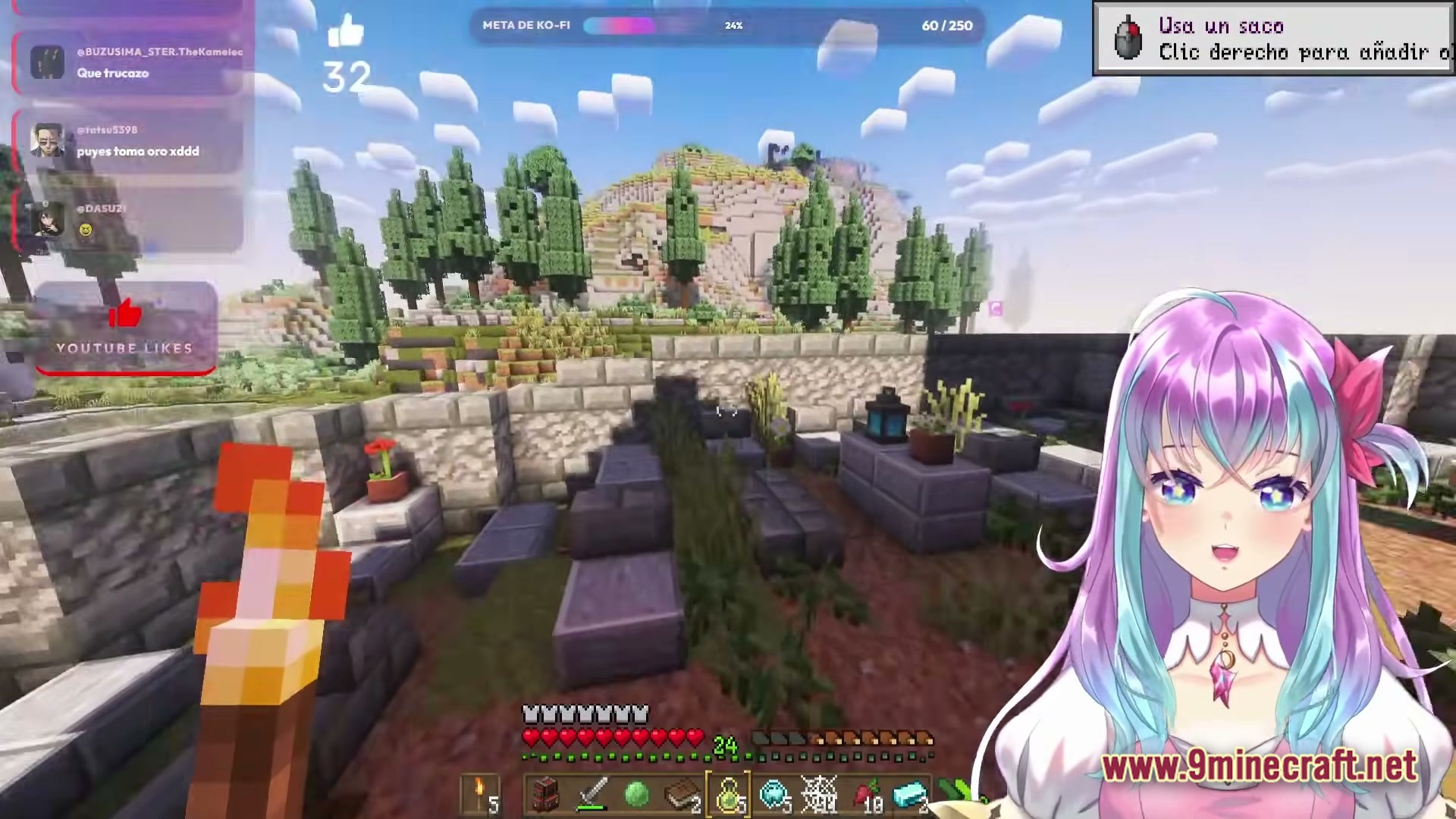 A player explores a stone structure in a hilly biome during a live vtuber stream