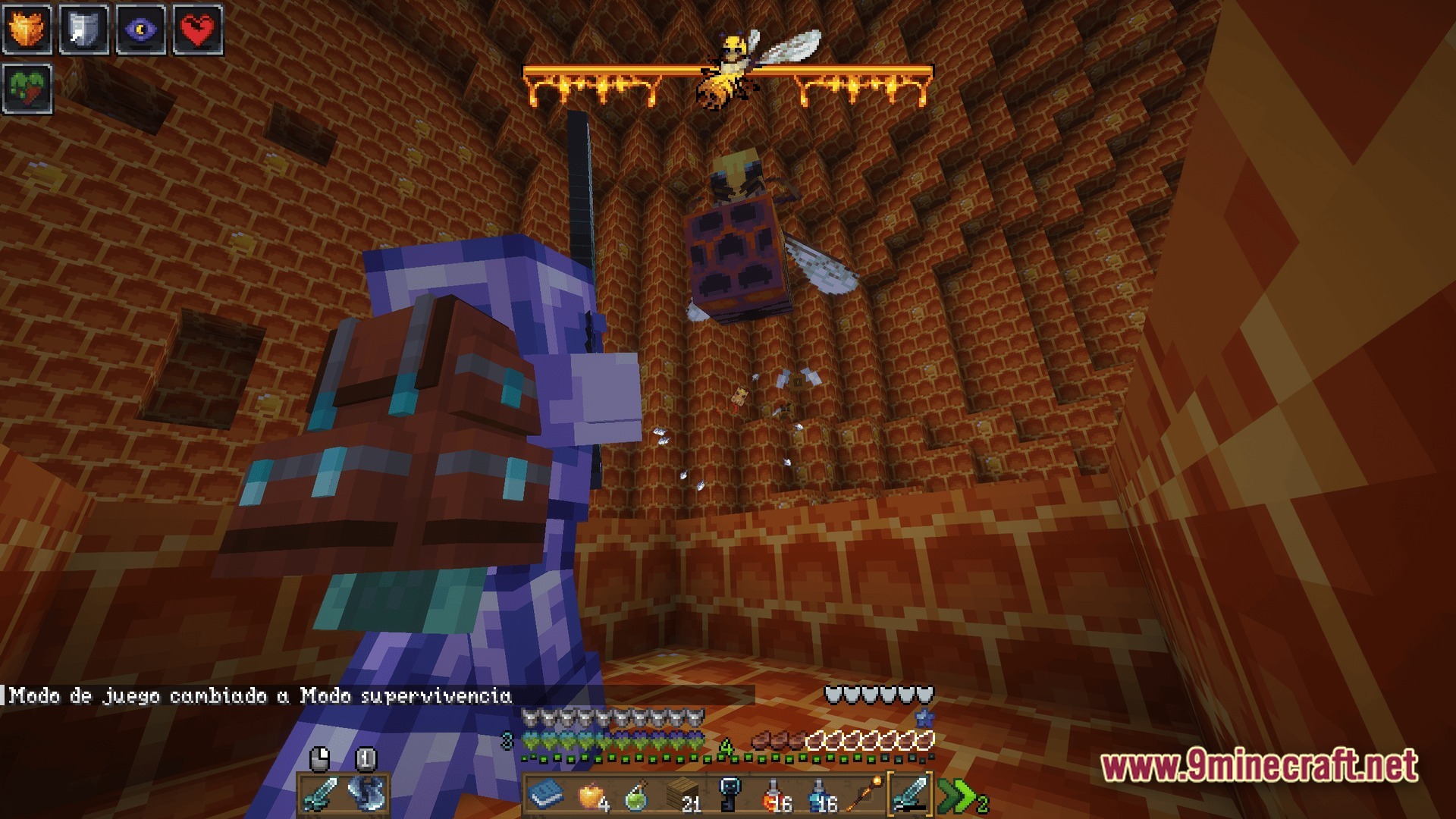 A player in netherite armor battles a giant bee boss inside a honeycomb-themed dungeon chamber