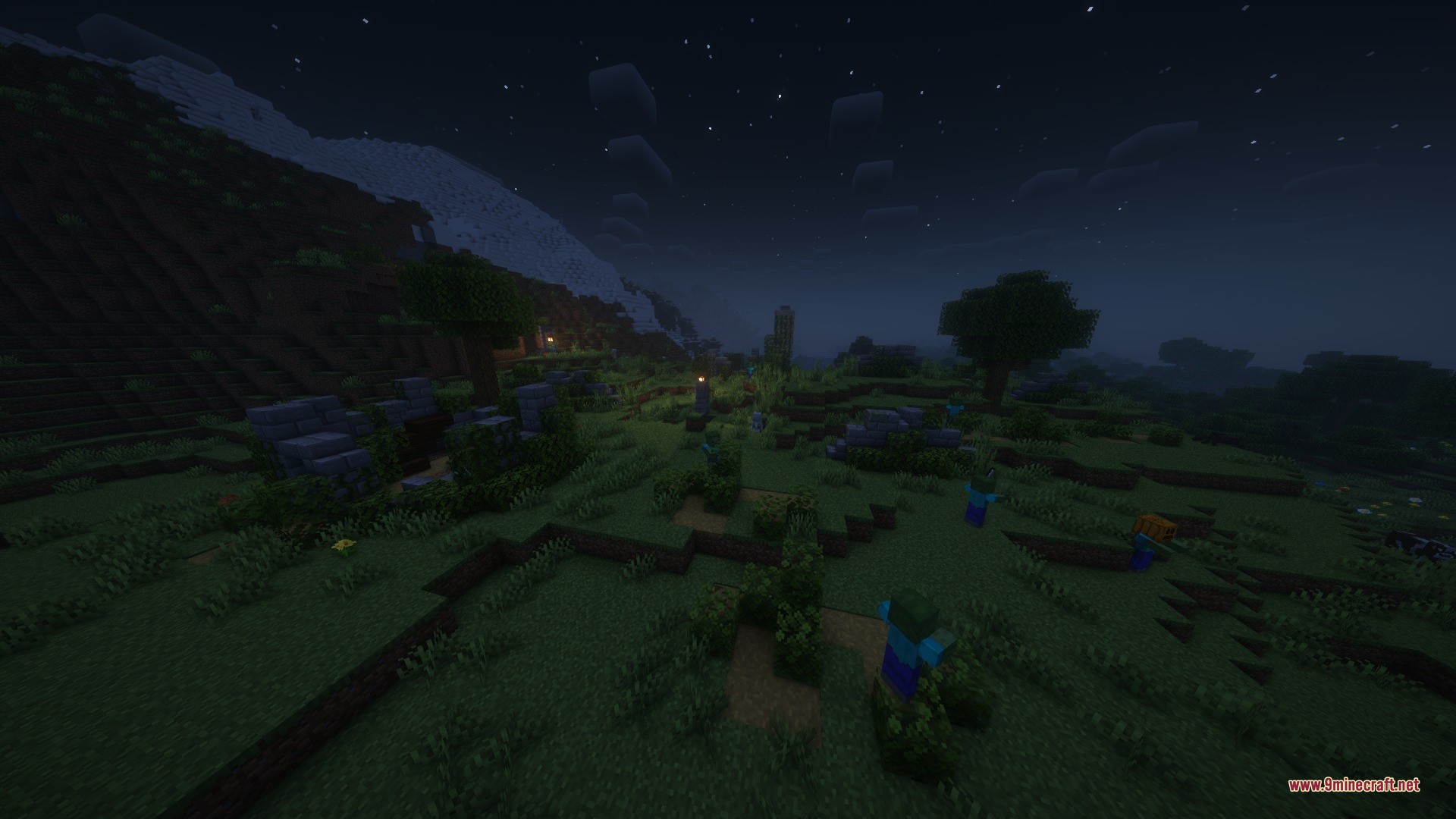 Zombies wander near small stone ruins in a grassy biome at night