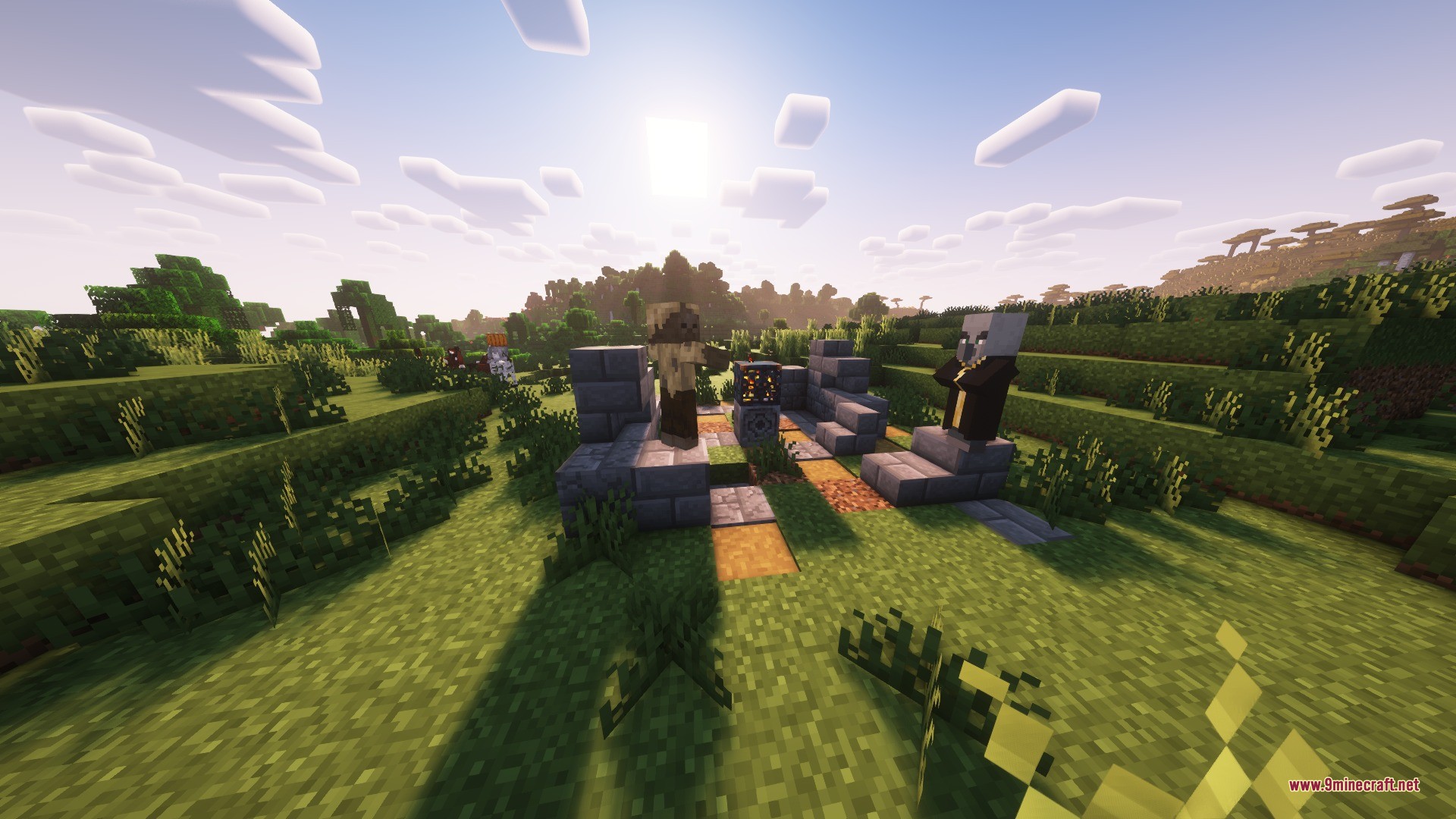An evoker and a husk standing near a stone ruin with a spawner