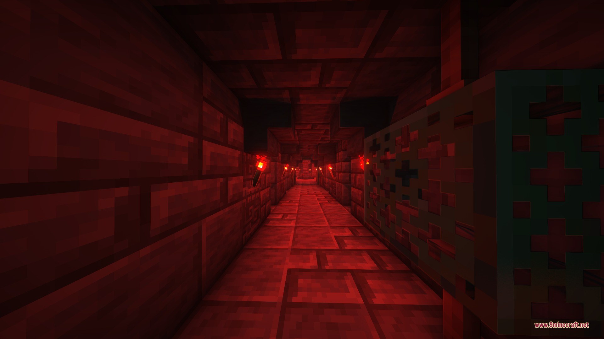 A dark underground corridor lit by redstone torches with stone brick walls
