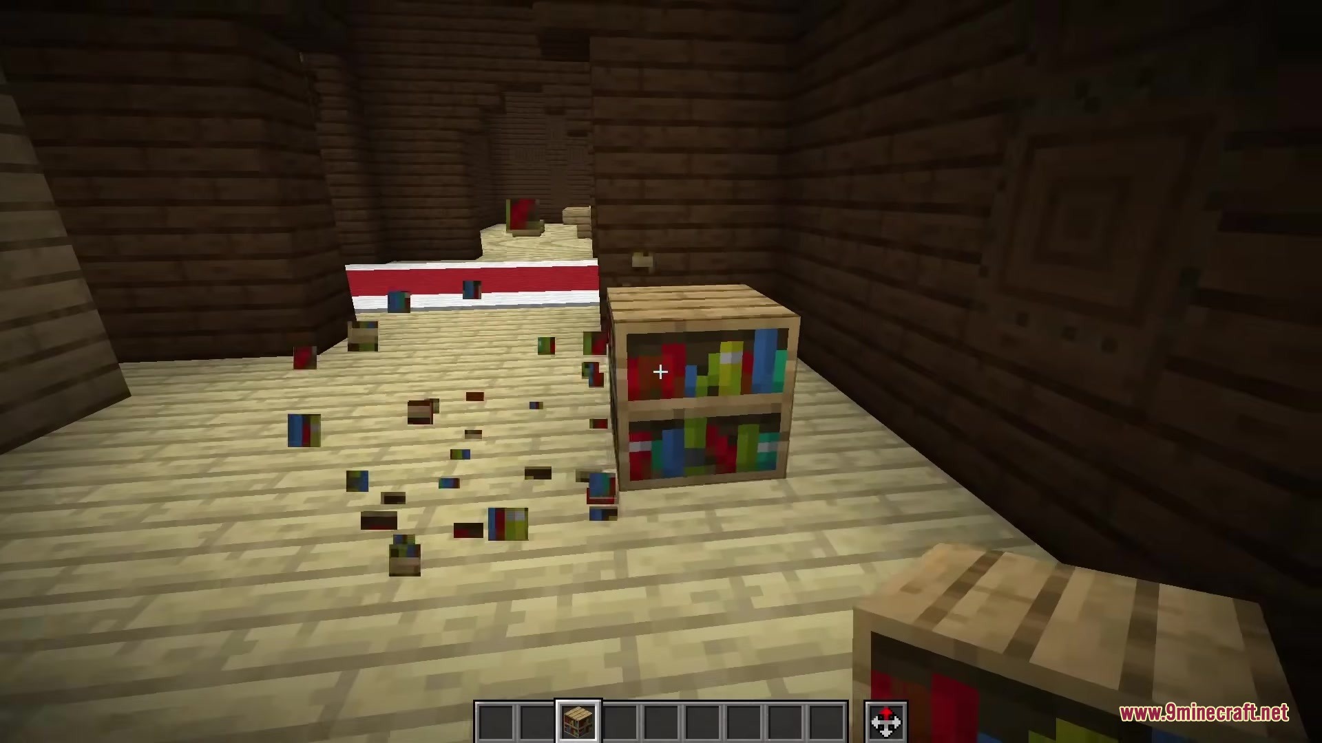 Keaton’s Reimagined Bookshelves Resource Pack (1.21.11, 1.20.1) 6 A player breaks a bookshelf block with book particles flying around