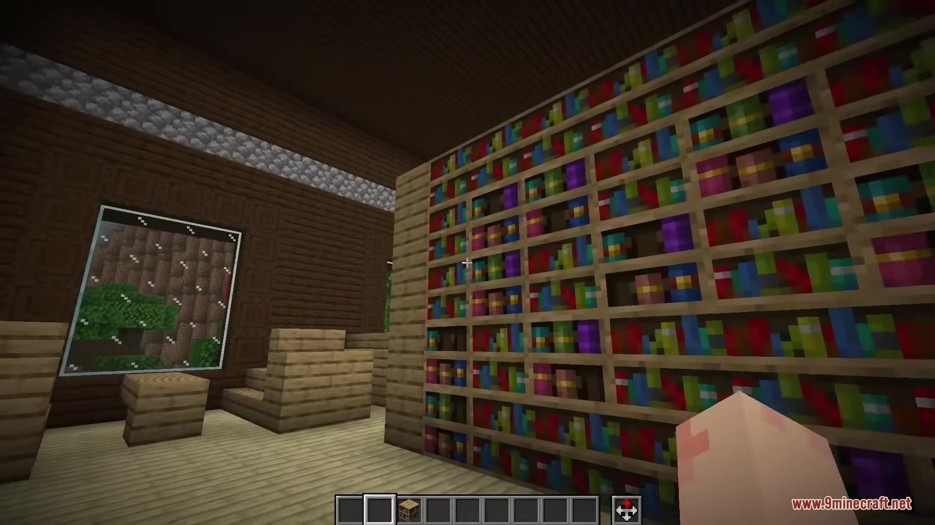 Keaton’s Reimagined Bookshelves Resource Pack (1.21.11, 1.20.1) 7 A large wall of detailed bookshelves inside a wooden minecraft room