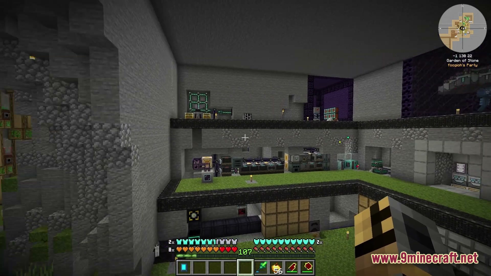 A multi-level underground base featuring various technical machines, storage systems, and a large nether portal