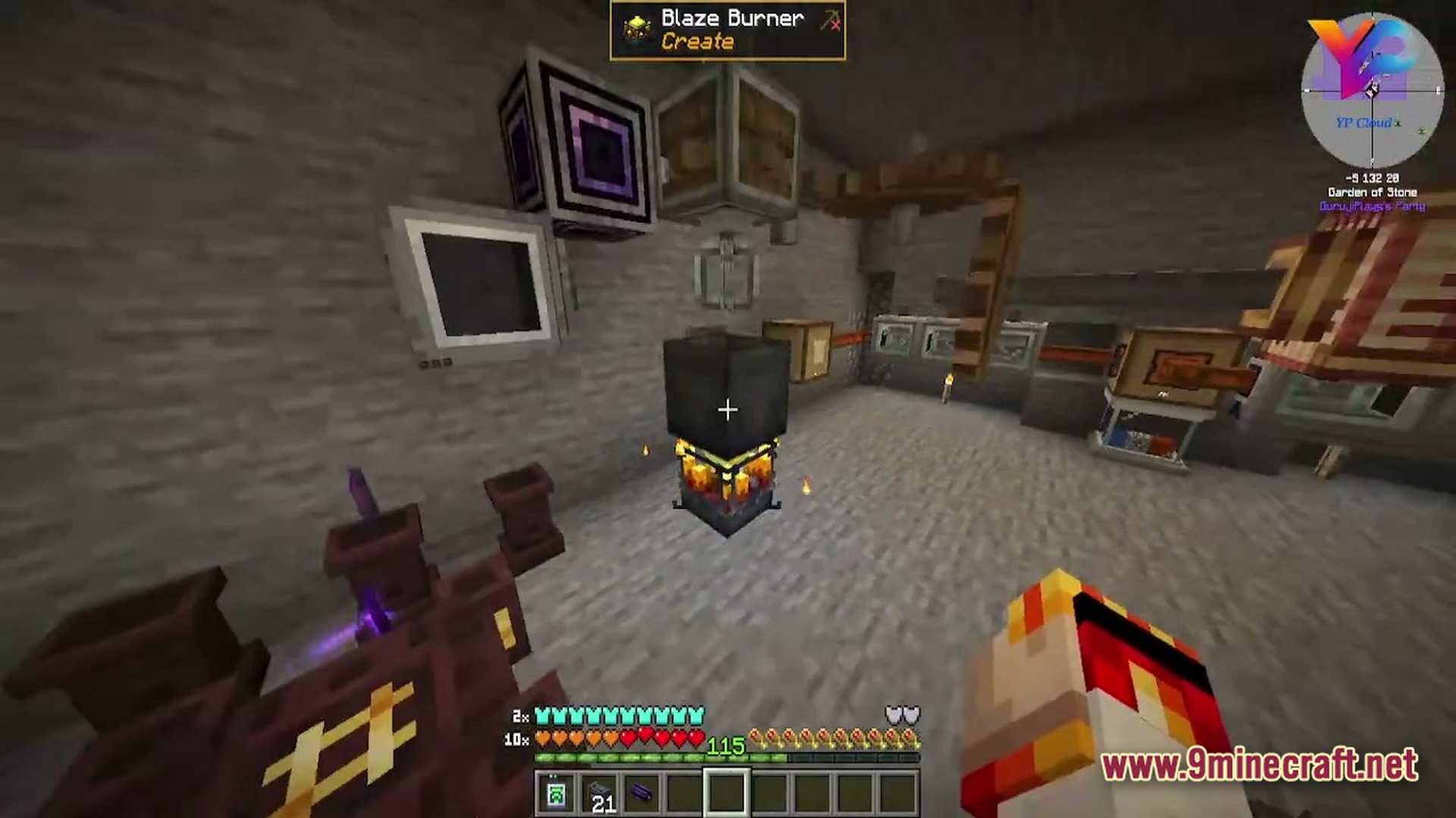 A player looks at a blaze burner and various industrial machines inside a stone base