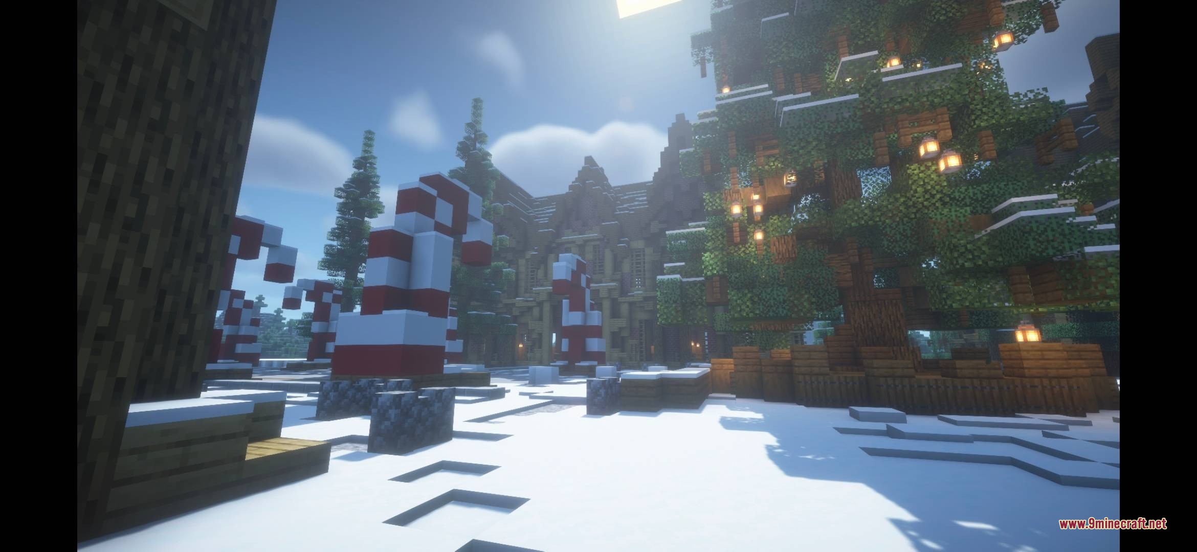 Moog’s Seasonal Expansion A Moogmas Miracle Data Pack (26.1.2, 1.21.1) 3 Giant candy canes and a decorated christmas tree in a snowy minecraft landscape