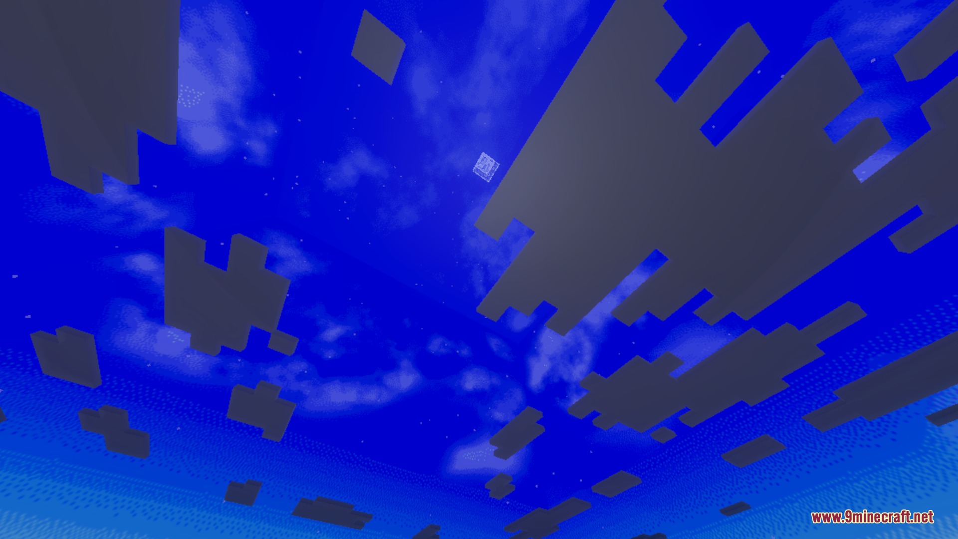 Looking up at a bright blue sky with white and dark clouds