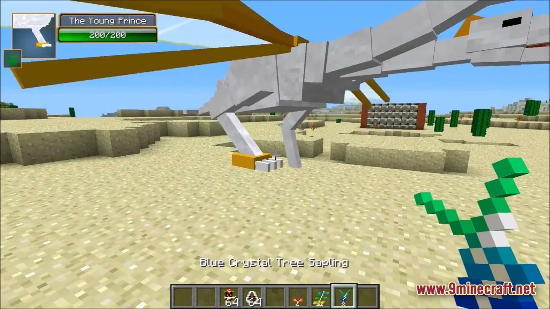 Ore Spawn Adventuree Modpack (1.20.1) – Crazy Dimensions And Giant Beasts 5 A player holds a blue crystal tree sapling while standing near the young prince dragon mob