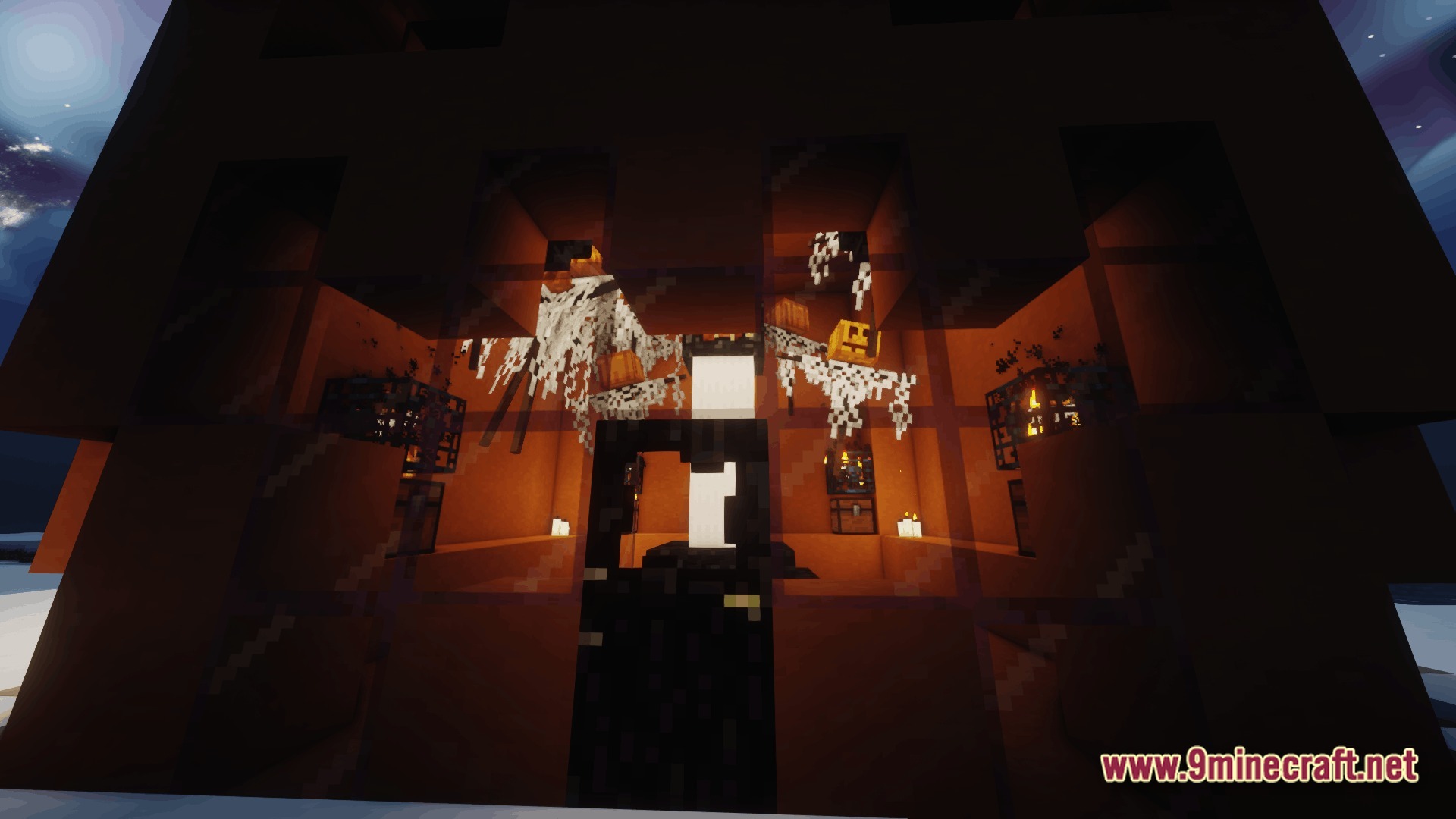 Ore Spawn Adventuree Modpack (1.20.1) – Crazy Dimensions And Giant Beasts 10 A dimly lit interior structure featuring cobwebs, pumpkins, and monster spawners behind glass panes