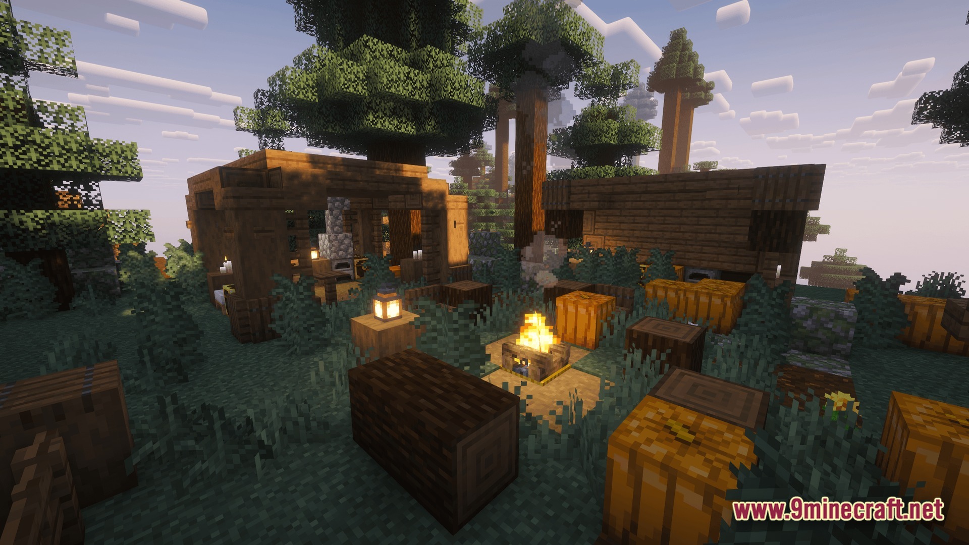 Perennial Core Modpack (26.1.2) – Classic Gameplay With Gentle Upgrades 2 A rustic campsite with a campfire, wooden structures, and pumpkins set within a dense forest biome