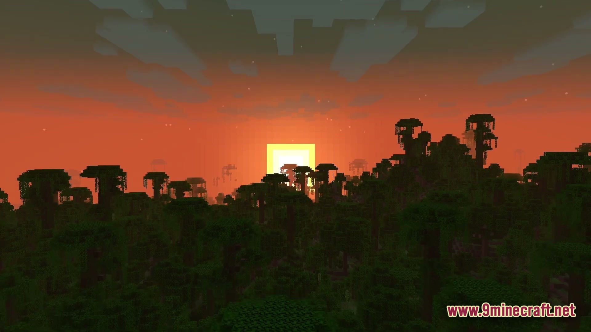 A square sun sets behind a dense jungle biome under a vibrant orange and red sky