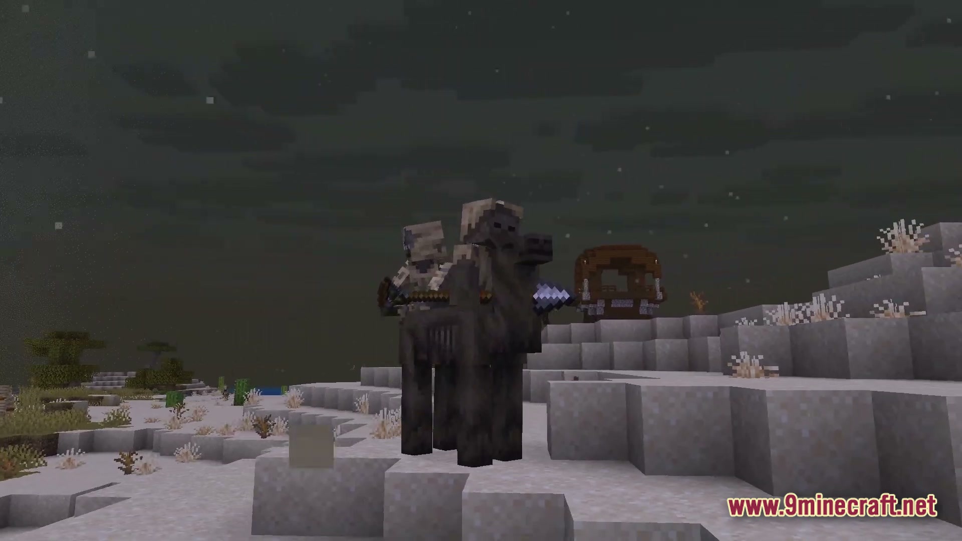 A skeleton riding a dark camel through a snowy desert landscape at night with structures nearby